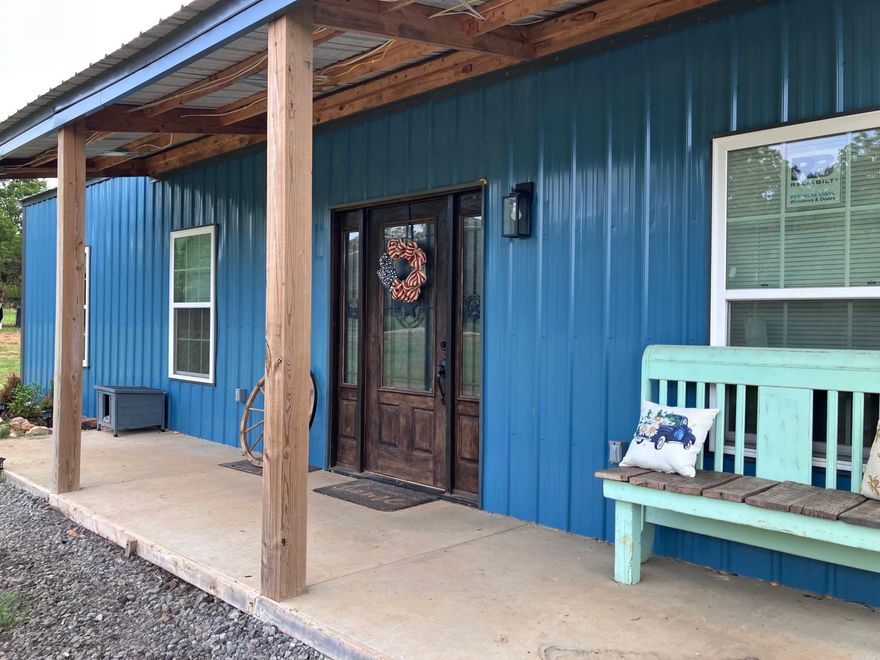 Ready to live the Country Dream on 6 Acres? Imagine waking up in a brand-new 2024-built home surrounded by peace, privacy, and room to roam. With nearly 2,000 sq. ft. of living space, this 3-bedroom, 2-bath home offers modern comfort in a country setting. Step inside to an open living room and kitchen with custom cabinets—perfect for gatherings. The spacious master suite features dual walk-in closets, a tiled walk-in shower, and double vanities. Outside, you’ll find the best of both worlds: pastureland for chickens, goats, horses, or any other critter your heart desires,  and wooded acreage full of deer and wildlife. Sit back and relax on the large covered back patio, or work in the 18X20 shop.  A metal carport also conveys.  This is the one you've been waiting for, so book a showing today!  Additional acreage is also available.  Agents, see remarks.