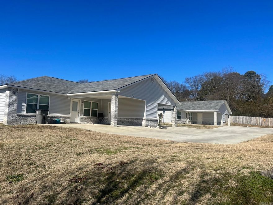 Location location location! Right off central close to bathhouse row, Oaklawn casino and horse track racing … shopping and dining. Close to lakes. This spacious apartment features 2 bedrooms and 2 bathrooms, perfect for those seeking a comfortable living space. The open floor plan allows for easy flow between the living room, kitchen, and dining area. Refrigerator provided. The kitchen boasts granite countertops, adding a touch of elegance to the space. Forget about the hassle of maintaining the lawn, as lawn care is provided for your convenience. Additionally, water and sewer are included in the rent, making budgeting a breeze. Space for full size washer and dryer plus walking distance to lake access!