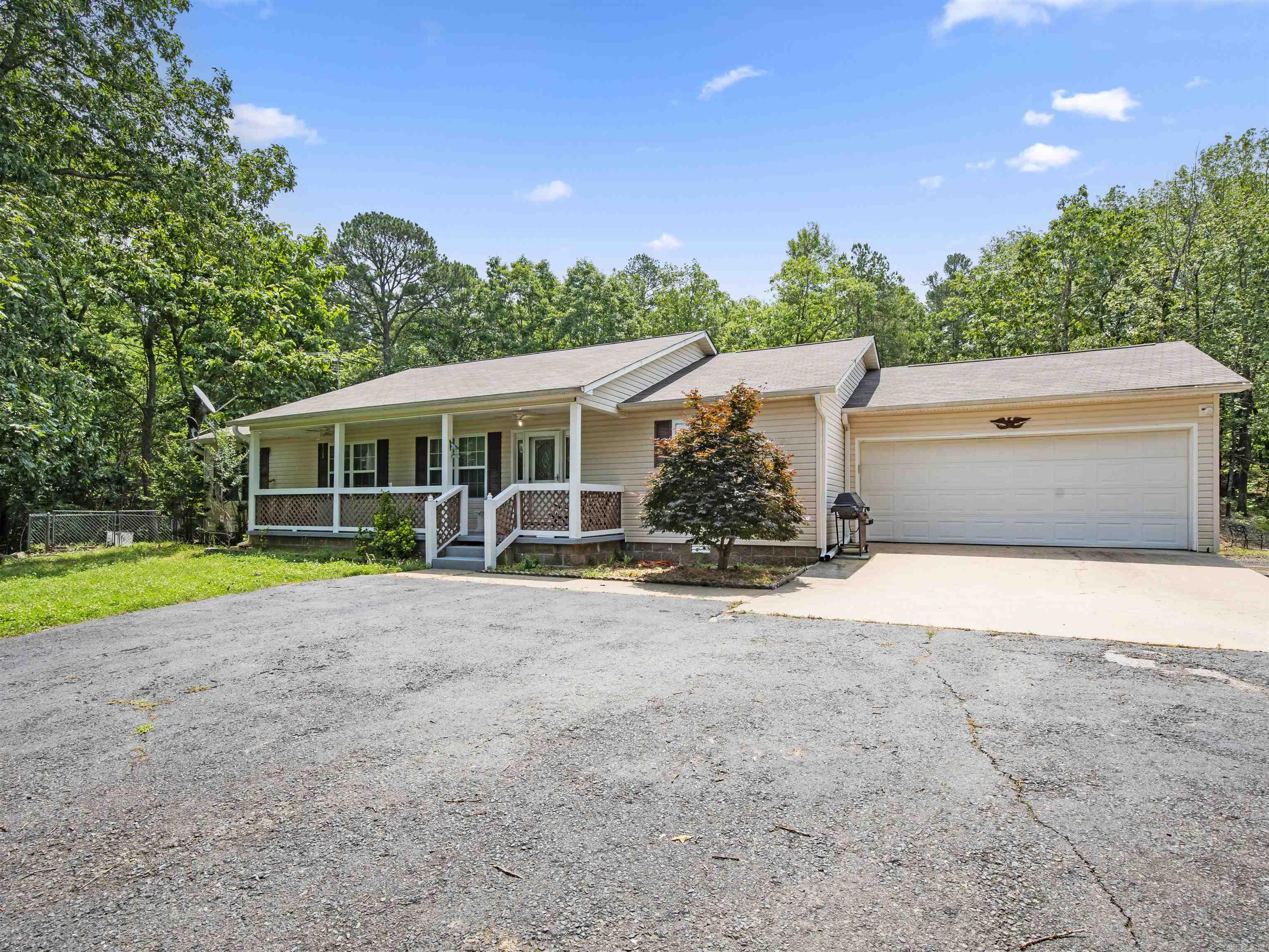 FOUNTAIN LAKE SCHOOL DISTRICT WITH 3.27 ACRES! Solid 3 bed 2 bath home with 2 car garage, covered front porch and covered back deck. Stainless appliances! LVP Floors! Roomy! All offers considered! Very good location less than 10 minutes from Hot Springs's Bathhouse Row! And just 15 from Oaklawn Racing Resort and Casing! And 10 minutes from the new bypass to Little Rock or 10 minutes from Hot Springs Village front entrance!