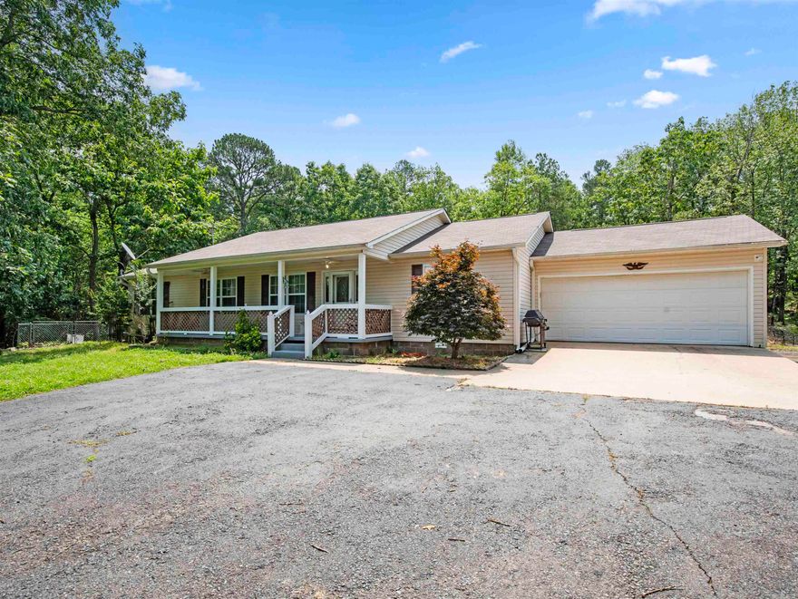 FOUNTAIN LAKE SCHOOL DISTRICT WITH 3.27 ACRES!  Solid 3 bed 2 bath home with 2 car garage, covered front porch and covered back deck. Stainless appliances! LVP Floors! Roomy! All offers considered! Very good location less than 10 minutes from Hot Springs's Bathhouse Row! And just 15 from Oaklawn Racing Resort and Casing! And 10 minutes from the new bypass to Little Rock or 10 minutes from Hot Springs Village front entrance!
