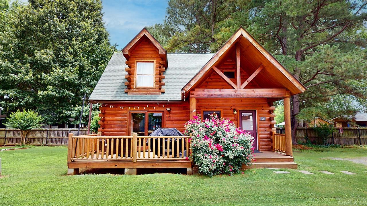 Escape to this cozy 2-bedroom, 1-bath log cabin nestled just steps from some of the states best trout fishing river. This rustic yet comfortable retreat offers a peaceful getaway with warm wood interiors, a welcoming front porch, and all the essentials for a relaxing stay. Currently operating as an active Airbnb, this property is turn-key (everything will convey) and is a current income-producing — perfect for investors, weekend adventurers, or those looking for a private escape. Cabin is custom built and includes rustic interiors including, Concrete floors on lower level, cedar columns in living room, tin roof, and charming kitchen with a bar made of repurposed barrels. You will also find a full bathroom downstairs with walk in closet and stackable washer/dryer. Upstairs offers two bedrooms with spacious closets. One bedroom offers extra seating area and the other offers a desk space. Whether you’re looking for a personal getaway or a proven short-term rental, this charming log cabin delivers on both comfort and opportunity! Showings will start on 6/23/25. Agents see showing time for availability.