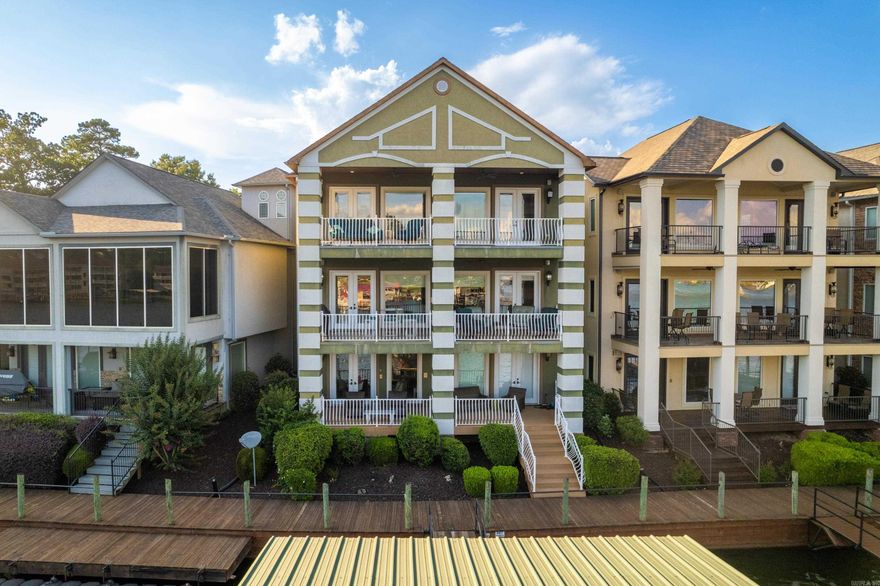 Welcome to 347 Paradise Point, where luxury meets lakeside serenity in the heart of Hot Springs, Arkansas. This stunning retreat on Lake Hamilton offers a spacious open floor plan adorned with slate tile flooring and hardwood cabinetry, creating an elegant yet inviting ambiance. The chef’s kitchen is a culinary dream, featuring stainless steel appliances, expansive counter space, and custom cabinetry—perfect for hosting gatherings or enjoying quiet meals with loved ones. Upstairs, the master suite is a private sanctuary, offering tranquil lake views and a spa-like bathroom complete with a soaking tub and a walk-in shower. Step outside to the spacious patio, where you can savor morning coffee or host unforgettable sunset gatherings against the backdrop of Lake Hamilton’s shimmering waters. The lower level is designed for comfort and convenience, featuring a cozy family TV room, a wet bar, two well-appointed bedrooms, and two full baths—ideal for guests or family. Recent 2023 upgrades include fresh interior paint, new carpeting, a professionally stained deck, a new roof, and a gas line with a grill, ensuring this home is move-in ready. Nestled in the Paradise Point community.