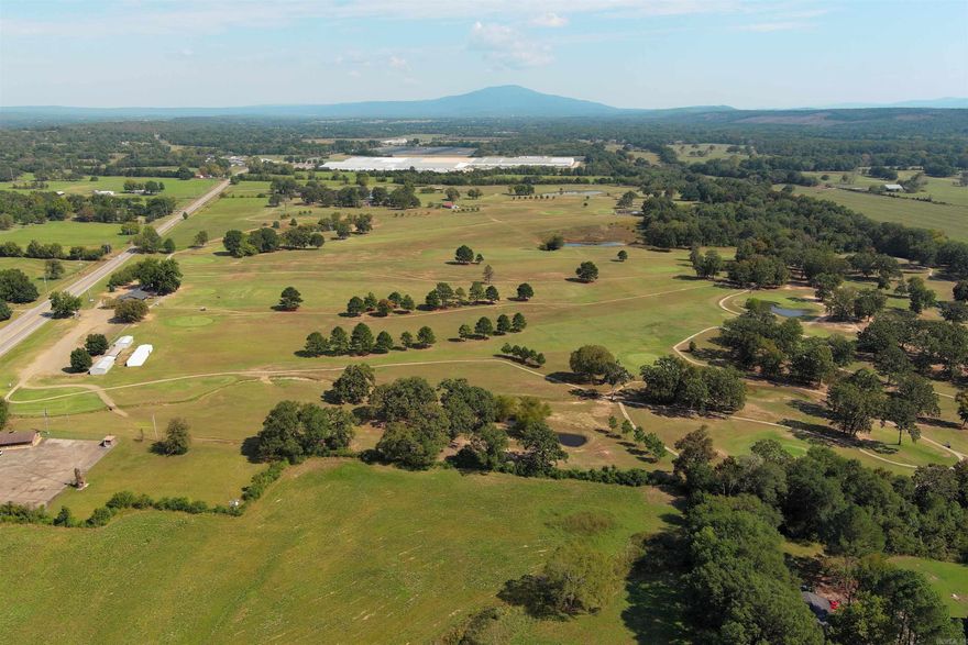 This 214-acre property includes the owner's golf course.  Nestled near the charming towns of Booneville, Greenwood, Fort Chaffee, and Fort Smith, AR.  The location is perfect for an estate home or could be subdivided for several homes.