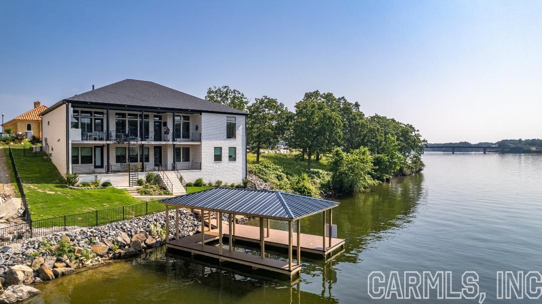 Luxury lake living for the discerning homeowner! This beautiful Wilson Point gem has all the upgrades you expect. Granite counters, custom cabinets, built-ins and amazing walk-in showers with custom stone & tile work. The large open floor plan with floor to ceiling views of the lake are perfect for entertaining. The upper deck boasts an outdoor grill, sink and fridge for outdoor dining. The lower level features a large bonus space complete with mini kitchen great for game night and summer activities.