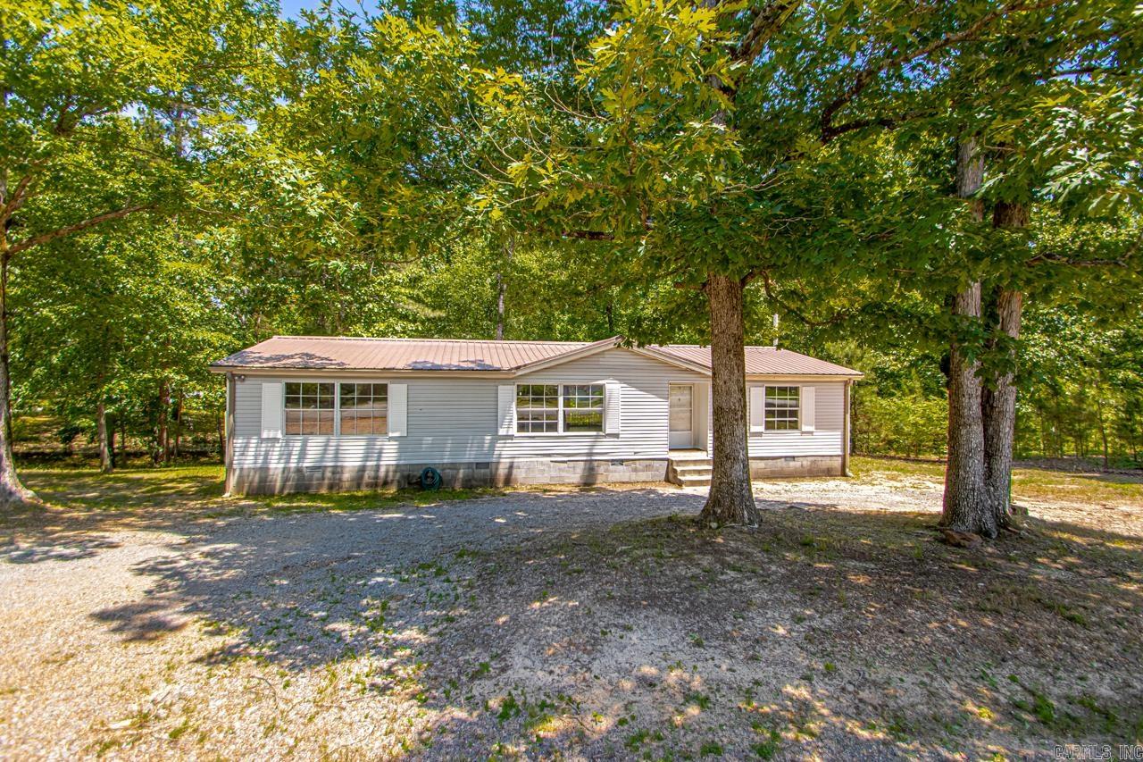 This updated home is great for a first time buyer!!! MOVE IN READY!! This home features approx. .73 acre lot. 3 bedrooms and 2 bathrooms with a split bedroom plan. Newer flooring and paint. New counter tops. The kitchen and dining area are open to each other. The living room is huge. You will have plenty of room for everyone in this property. The back covered porch is so nice for that morining coffee quiet time. Plus you are in the Bryant school district. You will not want to miss out on this great opportunity. See Remarks