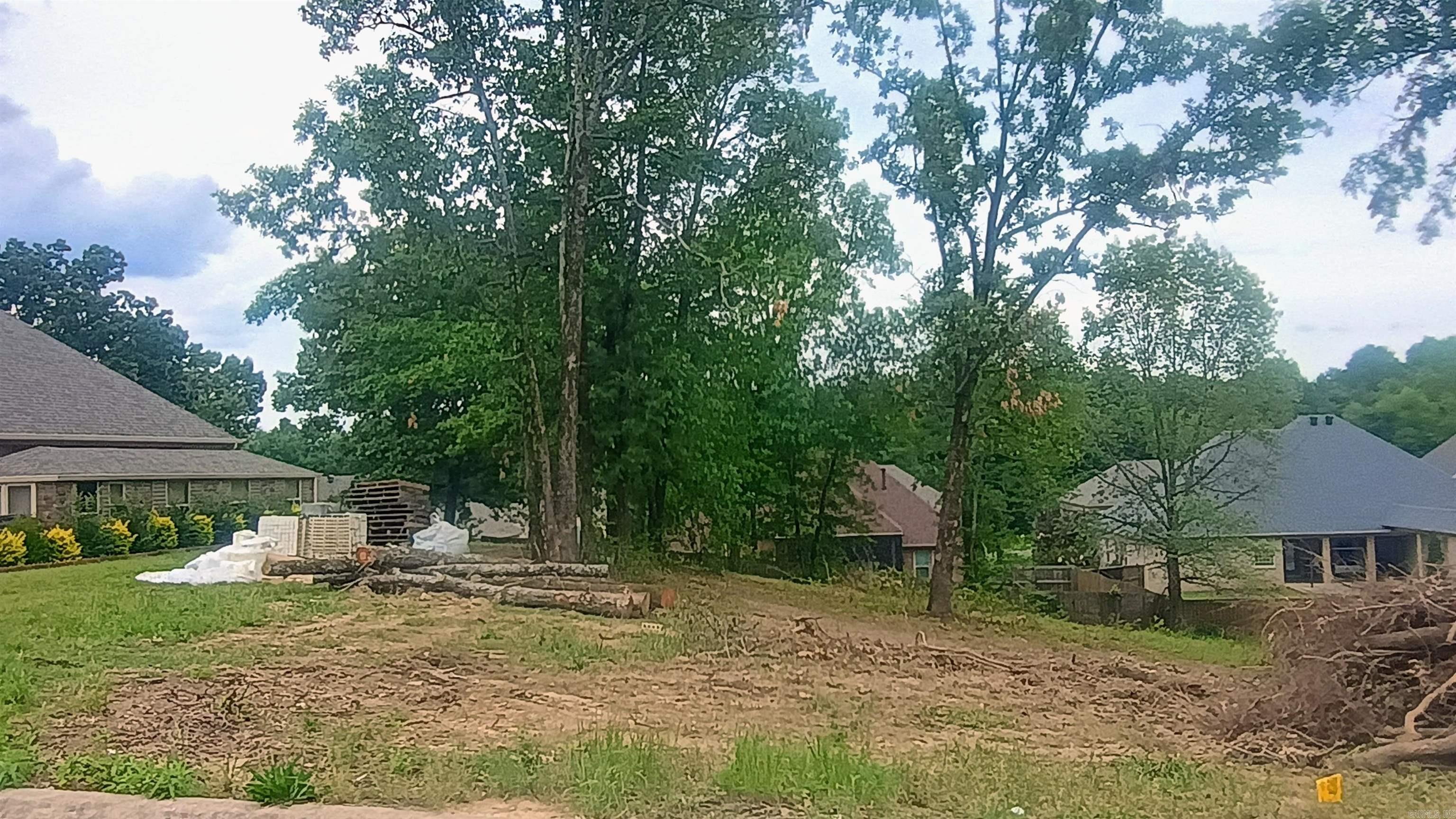 Located in a well-established neighborhood just off 7 South, this mostly cleared lot offers a gentle slope, making it ideal for a variety of home styles. Situated within the highly sought-after Lakeside School District, this property combines convenience, community, and value. City utilities are available at the street, providing an easy path to development. The lot’s natural contours and cleared condition mean minimal site prep, making it a perfect choice for your custom home or investment project. Enjoy the peaceful surroundings of an established neighborhood while being just minutes from shopping, dining, and all that Hot Springs has to offer.