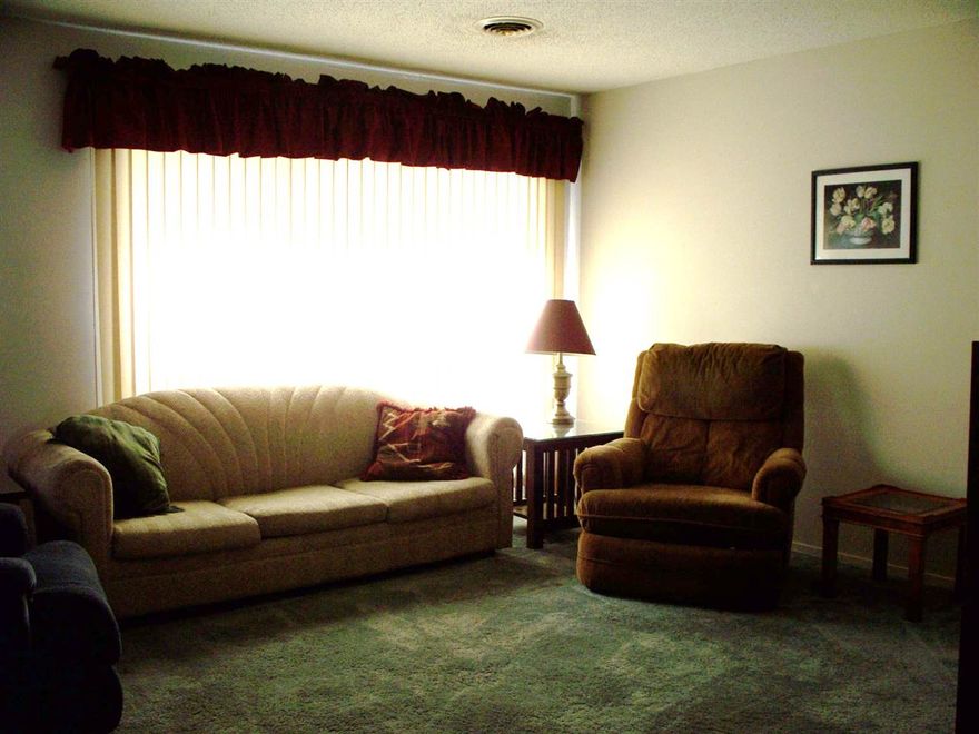 Older condo located in the heart of Fairfield Bay walking distance of pools, parks, tennis, bowling, shopping, library, fitness center, restaurants, and more  Back deck overlooks the woods.  Single car carport with small storage room.  Fully furnished.