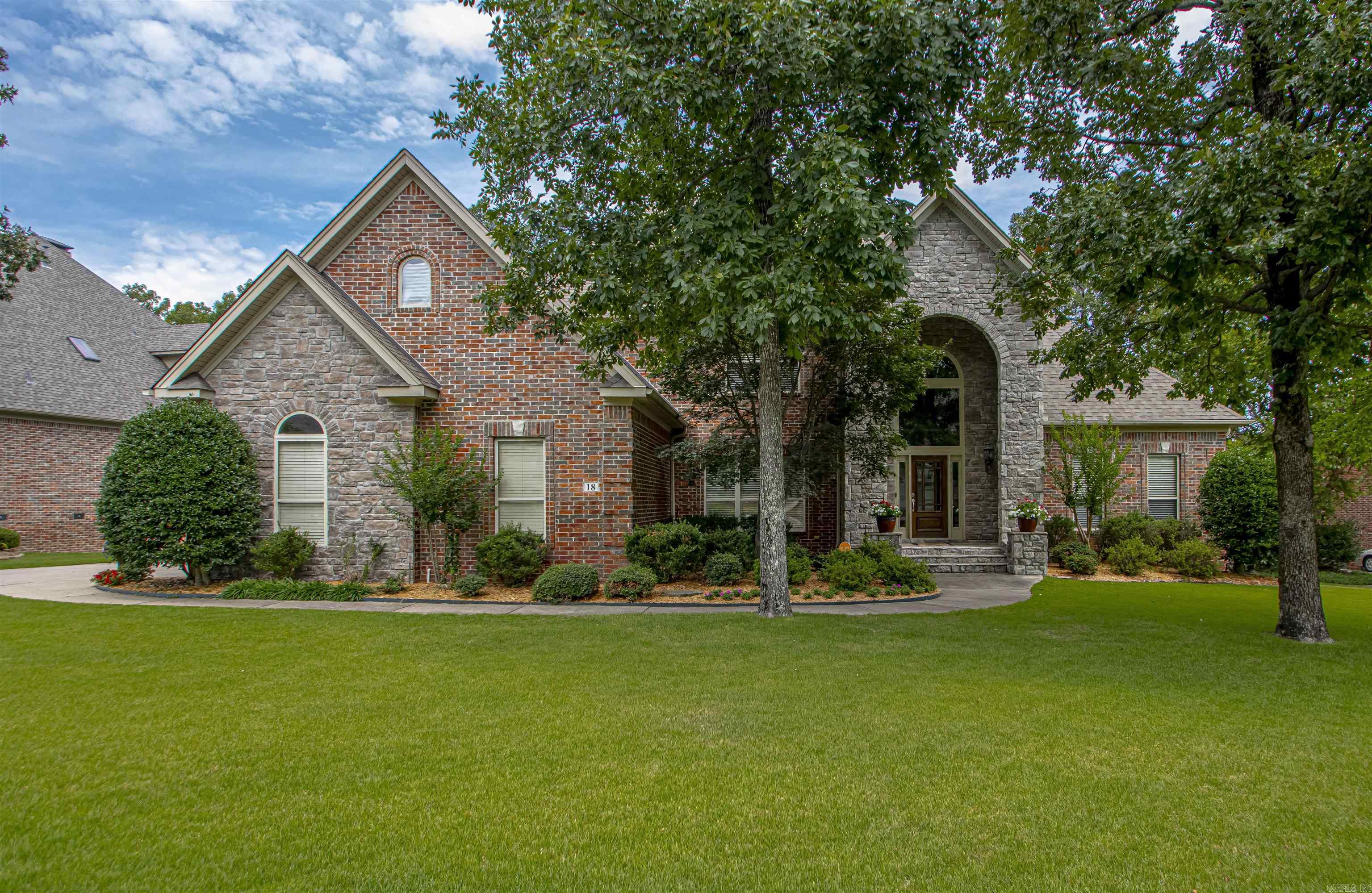 This wonderful, traditional home in Chenal sits on a large level lot with side loading 3 car garage. A 2 story foyer greets you with hardwoods, new light fixture and lots of natural light. The main level includes the dining room, great room, expansive kitchen with hearthroom, the primary bedroom and bath, and a second bedrm(currently an office) and ensuite bath. Upstairs you will find 3 additional bedrooms with ensuite baths, a bonus room and an office(or 6th bedroom). So many options on the space utilization. Lots of storage with 2 walk in attic spaces, walk in closets and underhouse storage. Nice covered deck to enjoy the outdoors. AGENTS--PLEASE read remarks BEFORE scheduling a showing.