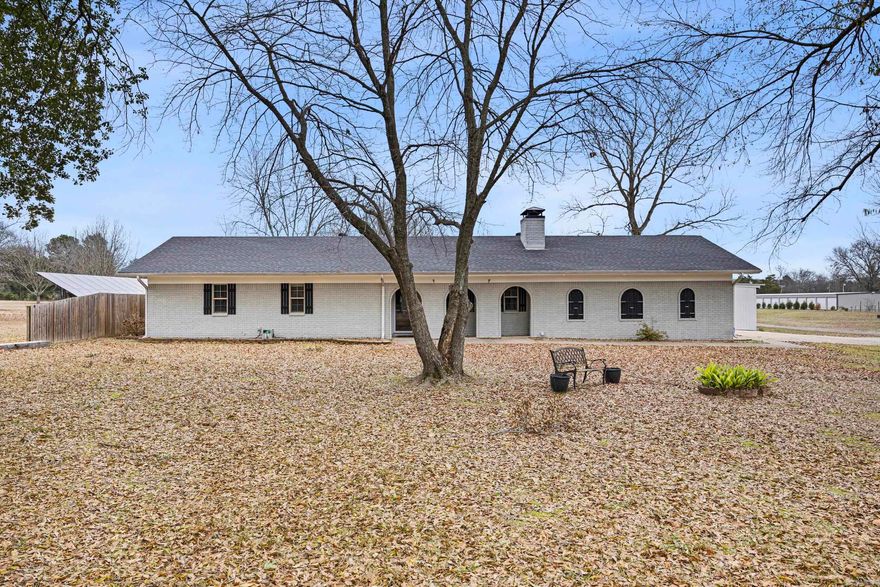 YOU CAN MOVE RIGHT IN TO THIS COZY HOME JUST A FEW BLOCKS FROM HWY 9 BYPASS.  SETTLE IN EVENINGS AROUND THE WOOD-BURNING FIREPLACE AND ENJOY THE COLD WEATHER.  FIREPLACE IS THERMOSTATICALLY CONTROLED WITH BLOWERS AND CAN HEAT THE HOUSE. THERE IS A CLOSET IN THE GARAGE TO LOAD YOUR FIREWOOD.    THE ROOF AND THE HVAC UNIT ARE ABOUT 5 YEARS OLD.  LOTS OF OTHER IMPROVEMENTS IN THE PAST 9 YEARS INCLUDING:  LIGHTING, FLOORING, CARPET, VANITY TOPS, DISHWASHER, FAUCETS, COUNTERTOP IN KITCHEN, PAINT (INSIDE AND OUT).  SELLER ADDED AN RV AND BOAT ENCLOSURE WITH STORAGE AREA IN THE BACK OF IT AND 200 AMP SERVICE.  THE HOME IS WIRED FOR A GENERATOR TOO.  IN THE OVERSIZED GARAGE THERE IS A CONVENIENT WORKSPACE WITH AN AIR CONDITIONER THAT COOLS THE GARAGE IF NEEDED.  SQUARE FOOTAGE WAS PROVIDED BY APPRAISER.