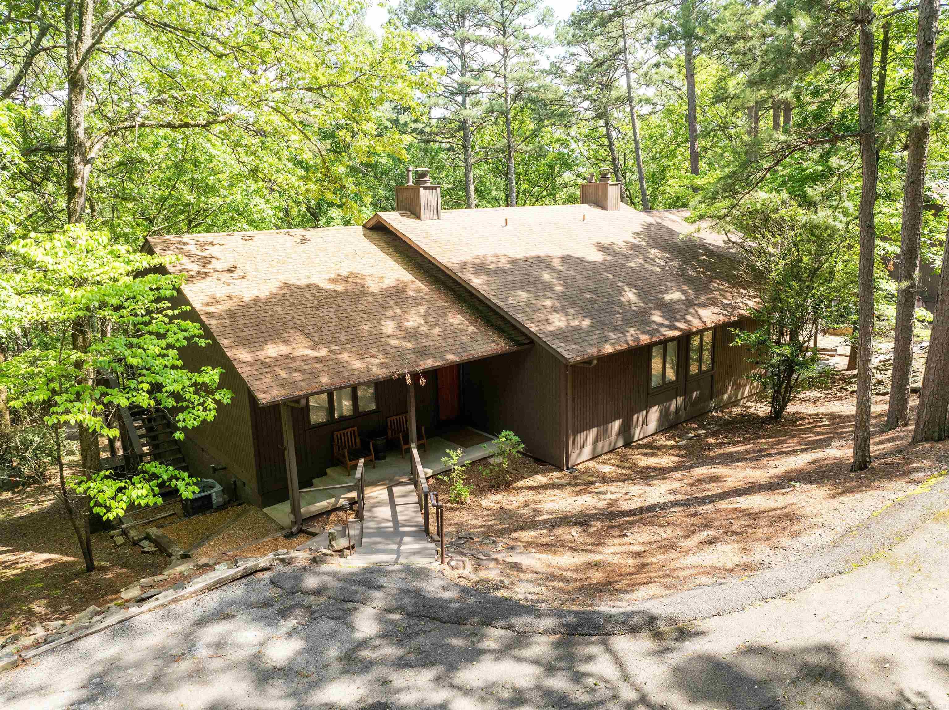 BEAUTIFUL EDEN ISLE CONDO, just a short walk to the RED APPLE INN!! The Eden Isle Marina is just a short golf cart ride away, so come enjoy the awesome Greers Ferry Lake. Features include gas fireplace, new counter tops, new appliances, some furnishings will convey, low maintenance hard flooring throughout, deck in the trees and a spectacular fire pit & sitting area. Decks can be shared or privatized w/ lockable barn door! There is interior access to unit next door. A wonderfully unique opportunity! Come see this condo and enjoy your time on Greers Ferry Lake. The adjoining unit is also for available to purchase.