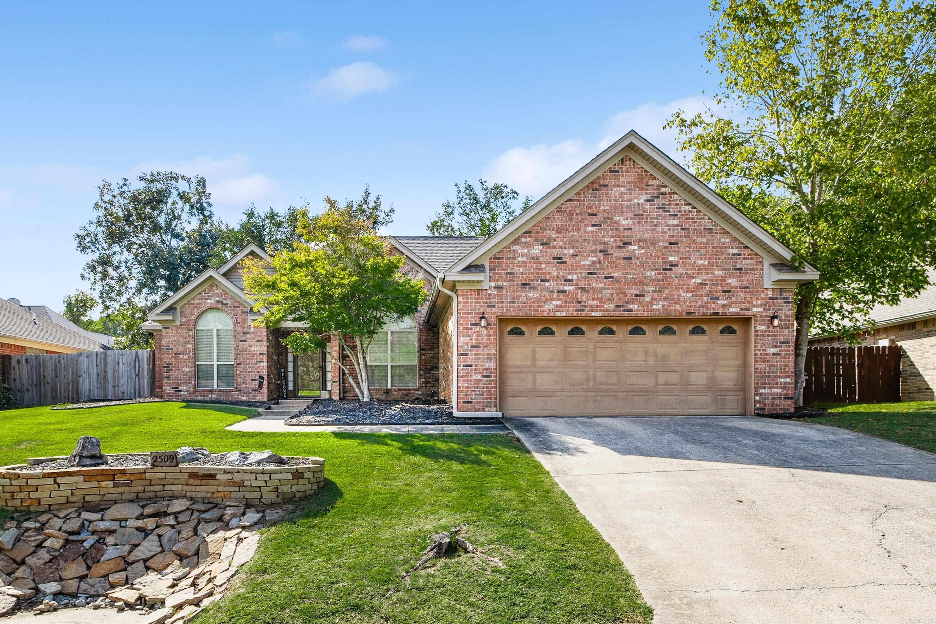 This all-brick home in the Benton School District offers three bedrooms and two bathrooms with a well-planned split layout. The oversized primary suite includes a tray ceiling with a sitting area, plus an ensuite bath with a double vanity, separate soaker tub, and walk-in shower. The two additional bedrooms each feature good-sized closets for plenty of storage. Vaulted ceilings create an open feel in the living area, while the kitchen provides a breakfast bar, room for a table, and access to the formal dining room. Step outside to enjoy a private backyard with a patio and new decks, offering the perfect setting for outdoor relaxation or entertaining. Recent updates add peace of mind with a new roof in 2019, HVAC replaced in 2017, and a new water heater in 2025. Combining durable brick construction, spacious interior features, and inviting outdoor spaces, this home is a comfortable and convenient option in a great Benton location.