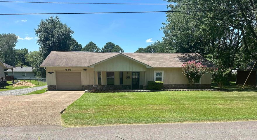 Charming Updated Home Near Sandy Beach!  Welcome to 424 Lee Street, a beautifully updated 3-bedroom, 2-bath home in the heart of Heber Springs! Featuring 1,612 square feet of comfortable living space, this home boasts NEW appliances in kitchen, NEW washer & dryer, NEW ceiling fans, NEW HVAC, fresh NEW flooring and paint throughout, offering a move-in ready feel. The spacious kitchen and living areas are perfect for relaxing or entertaining.  Enjoy the convenience of a 3 car 30x30 insulated shop—ideal for hobbies, storage, or workspace—well as and a storm shelter for added peace of mind. Situated within walking distance to Sandy Beach on Greers Ferry Lake and nearby schools, this property offers the perfect blend of location, comfort, and functionality.  Whether you're looking for a full-time residence, a vacation home, or an investment opportunity, this one checks all the boxes! Don't miss your chance to make it yours!