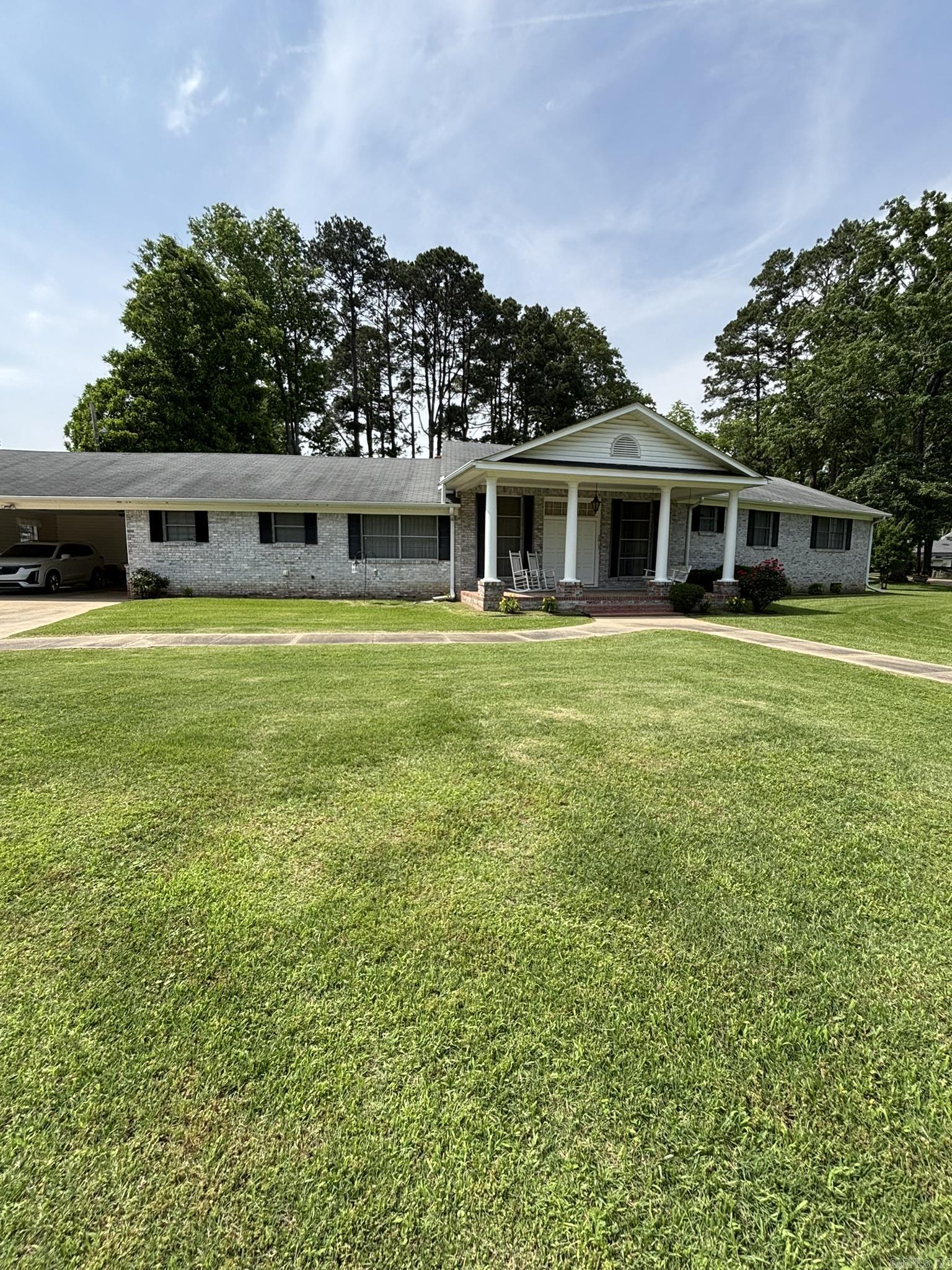 One owner traditional custom built home. 3 bedroom, 3 bath home. Rooms are large and spacious. Den area with fireplace and built in cabinets. Formal living room with tall ceilings. Floors are hardwood, carpet and vinyl. Large master bedroom with walk in closet in the master bath. 2 car garage with large carport storage. Central heat and air, also has a Kohler generator. All appliances included, and most of the furniture will stay with home. The home is brick with siding trim.