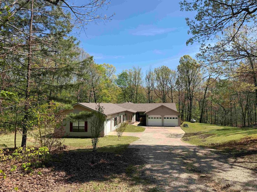 This one has it all! Rolling hills, 5 acre wooded lot, over 4000 sq ft home with 3 car garage, indoor pool & hot tub room! This spacious home has 4 BR, 4 1/2 baths, a large tiled entry, heated & cooled workout/flex room off the pool area with attached 1/2 bath. There is a large living room with beautiful views, open kitchen/ dining area, spa/hot tub area w/attached bath & access to the large deck/ gazebo.  New carpet, roof & HVAC in 2024, New HVAC unit for pool/workout area in 2025. Seller will pay buyer closing costs up to $8500. New survey to be provided. Additional acreage available. By appointment only! See agent remarks.