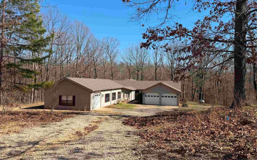 This one has it all! Rolling hills, 5 acre wooded lot, over 4000 sq ft home with 3 car garage, indoor pool and hot tub room! This spacious home has 4 BR, 4 1/2 baths, a large tiled entry, heated and cooled workout/flex room off the pool area with attached 1/2 bath. There is a large living room with beautiful views, open kitchen/ dining area, spa/hot tub area w/attached bath & access to the large deck/ gazebo.  New carpet, roof and HVAC in 2024, New HVAC unit for pool/workout area in 2025. New survey to be provided. Additional acreage available. See agent remarks.