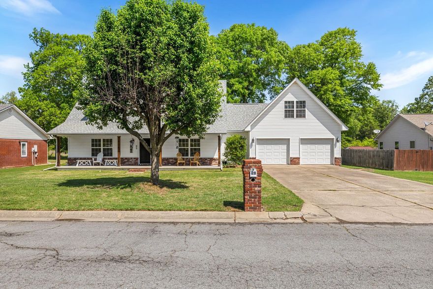 Welcome to 28 G Street in Cabot! As you arrive, you’re greeted by a charming front porch perfect for morning coffee, shaded by a mature tree and set on a spacious lot. Step inside to a warm and inviting living room featuring a cozy fireplace and beautiful wood-look tile flooring that flows throughout the main level. The layout opens into a large dining area and an updated kitchen complete with white cabinetry, ample counter space, and a functional layout ideal for everyday living or entertaining. Head upstairs where the home truly shines with its flexible design—offering a large landing room leading to 2 bedrooms plus a bonus (or 3 bedrooms) and a full bathroom. Just off the kitchen, you’ll find convenient access to the laundry area, half bath, and garage with bonus above. Each room offers great natural light and versatility for offices, playrooms, or additional living space. The spacious primary suite provides comfort and privacy, while additional rooms give everyone their own space. Step out back to enjoy the deck, perfect for relaxing or hosting with storage shed and green space behind. This well-kept, updated home offers space, flexibility, and comfort all in one!