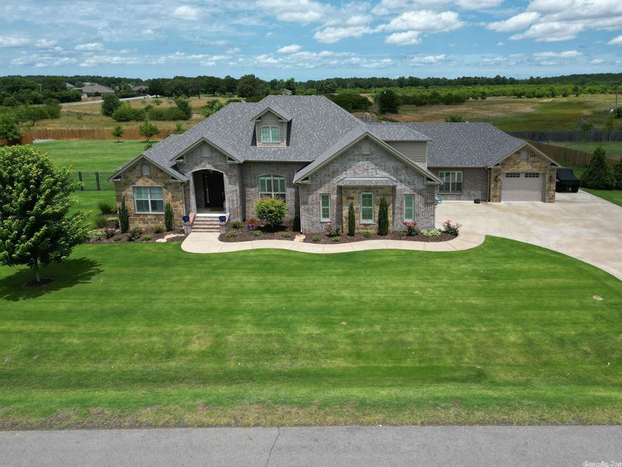 Unveiling 2360 Springcrest St., Conway - a 4BR/3BA oasis on 1.33 acres. Boasting a 3-car garage with custom cabinets, finished floors, and an enviable custom pool. The kitchen shines with Cambria quartz countertops and a walk-in pantry. Indulge in comfort with hardwood floors, plush carpet in two bedrooms, and a bonus room. Stay organized with dual walk-in closets, a spacious laundry room, and a bonus room upstairs. Relax outdoors on a covered porch, complete with a TV, overlooking a fully fenced, irrigated yard. New roof in 2022.  Luxurious living awaits! This truly is one of a kind, a must see!