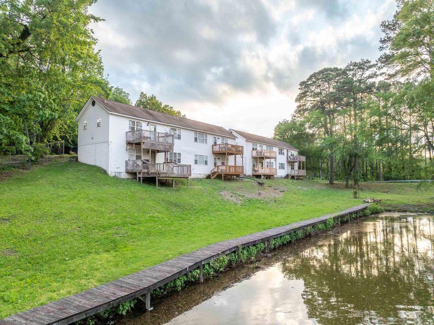 Turnkey 6-Unit Lakeside Investment Property – Renovated 2 Bed / 2 Bath Units on Lake Hamilton  Discover an exceptional investment opportunity on the tranquil shores of Lake Hamilton in Hot Springs with this beautifully remodeled 6-unit duplex-style complex. Each of the six units is a spacious 2-bedroom, 2-bathroom layout spread across two levels, offering thoughtful design and comfort for both long-term tenants and vacation guests.  Every unit has been fully updated with modern finishes, including new appliances, contemporary kitchens, stylish bathrooms, fresh flooring, and upgraded fixtures—making this a true turnkey opportunity. Two of the units feature private fenced-in yards, perfect for tenants seeking extra outdoor space, while the remaining four units boast gorgeous, direct lake views. All residents enjoy shared access to a scenic boardwalk, fire pit area, and high-speed internet, enhancing both livability and vacation appeal.  With potential monthly income of $2,100 per unit, the property could generate up to $12,600/month when fully optimized, offering a strong return as-is or even greater upside if converted into mid-term or short-term rentals (Airbnb).