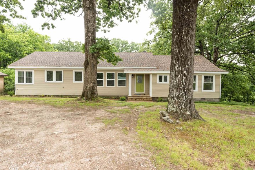 A dream retreat! This beautifully remodeled 3-bedroom, 2-bathroom home sits on just under an acre of land, offering the perfect mix of modern comfort and quiet country charm.Step inside to discover brand-new flooring, updated windows, and an abundance of natural light throughout. The spacious sunroom is a true highlight—ideal for plant enthusiasts, bird watchers, or anyone looking to relax and soak in the views year-round. Enjoy the serenity of your private surroundings while being just minutes from town, giving you quick access to shopping, dining, and amenities without sacrificing peace and quiet. Move-in ready and thoughtfully updated, this home is a rare find.