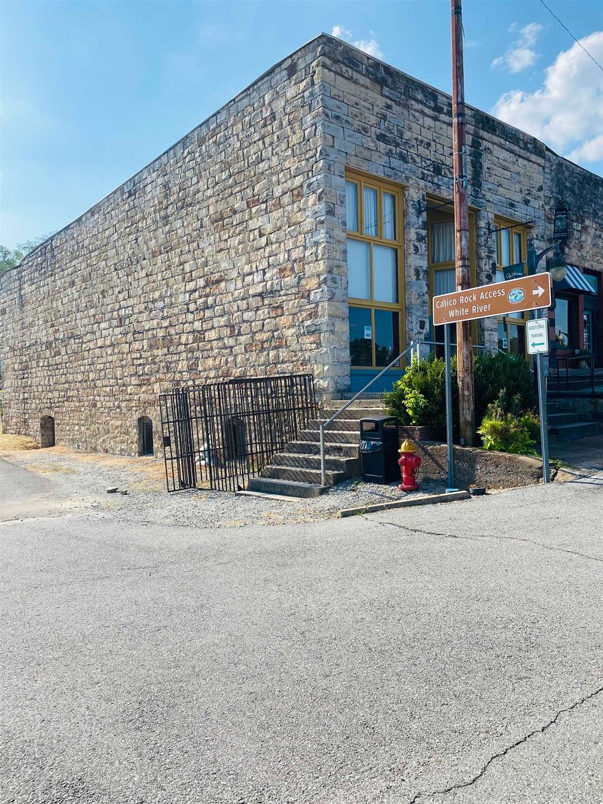 Step back in time with this beautiful historic building for sale in downtown Calico Rock, Arkansas. Built with all the charm of the early 19th century, this well-maintained property offers endless possibilities.  Currently used as a retail location, it can easily serve as a combination residential and commercial space, making it an ideal investment for those seeking both business and living opportunities in one. The building offers approximately 3,800 sq. ft. of versatile floor space across two stories with a basement, giving plenty of room for your creative vision.  Inside, you’ll find a 2-bedroom living space and a half bathroom. Outside, enjoy a scenic river view that adds even more appeal to this unique property.  Whether you’re looking to establish a storefront, create a mixed-use residence, or invest in one of Calico Rock’s historic downtown properties, this building is ready to inspire.