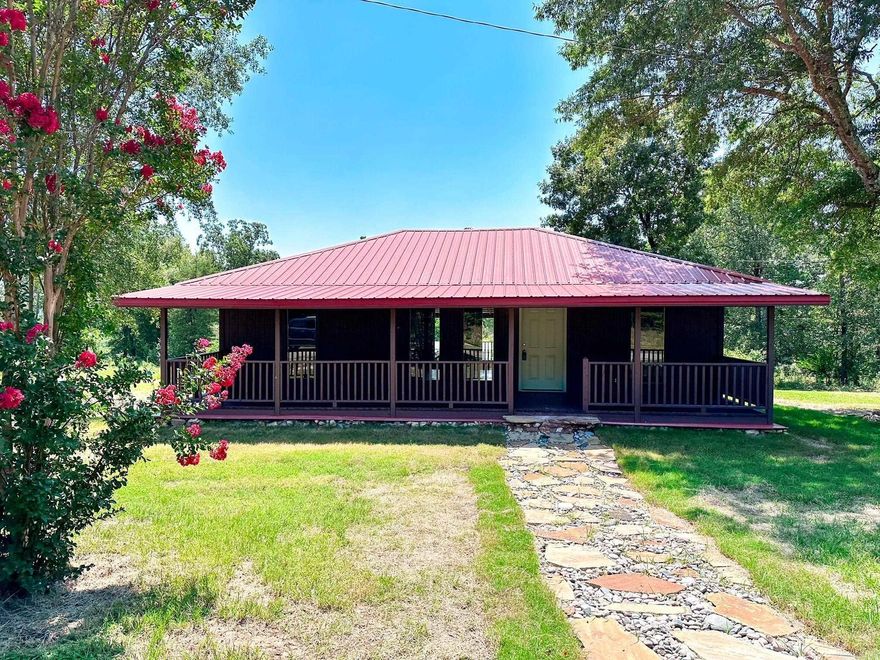 Escape to this charming 2 bedroom, 1 bath cabin, perfectly situated less than 3 miles from The Choctaw Recreation area of Greers Ferry Lake. Nestled on a spacious 0.90 +/- acre lot, this cozy home offers both tranquility and convenience. Enjoy peaceful mornings on the large front or back deck, ideal for soaking in nature. This property boasts a 20x30 carport with storage, providing ample room for vehicles & outdoor gear. Inside, modern updates shine with luxury vinyl flooring, fresh paint, butcher block countertops, and upgraded stainless appliances, all less than a year old. The bathroom features a newly installed tub, toilet and vanity, all completed in 2023. Whether you're looking for a weekend getaway or a serene full-time residence, this cabin offers the perfect blend of rustic charm and modern comfort. This property would make a great short-term rental as well!