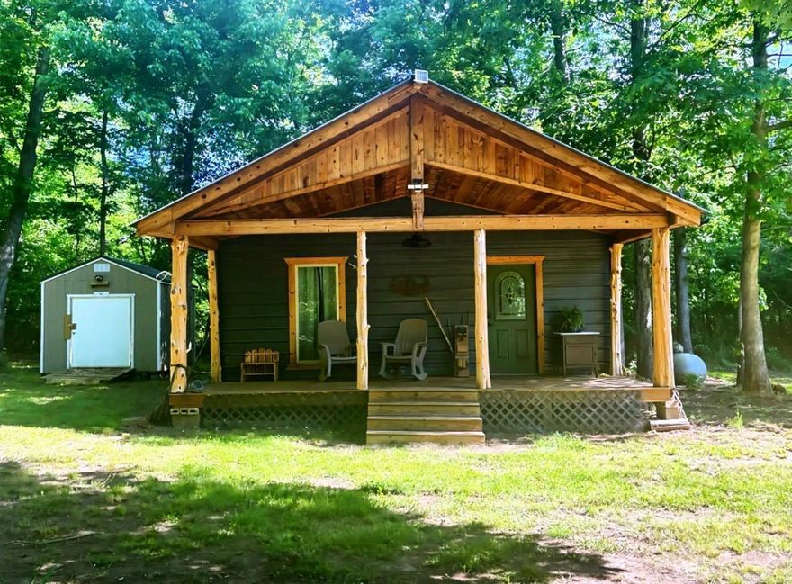 Escape the noise and settle into your own private retreat with this charming off grid- dream cabin tucked away on 40 beautiful wooded acres. Whether you're looking to homestead, hunt, unplug, or create a peaceful getaway, this property offers the perfect blend of comfort and self-sufficiency. The rustic cabin features a front porch, warm wood accents, and a cozy country feel. Designed for independent living, the property includes solar-generated electricity for lighting and a generated water system, making it ideal for off-grid living or sustainable homesteading. Surrounded by mature trees and abundant wildlife, the acreage provides endless opportunities! If you have been dreaming of land to make truly your own, this unique property is ready for its next adventure!