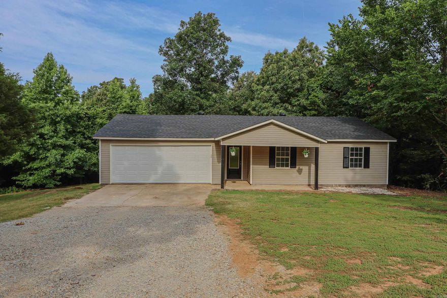 Country setting with remodeled three bedroom, two bath home sitting on 3.06 wooded acres built in 2000. New Deck overlooking the property within minutes of the city of Paragould. Updates include brand new Roof, HVAC only a couple years old, New water heater, New stainless appliances including refrigerator, new flooring all new interior and some exterior doors, new garage door, new plumbing fixtures, new vanities and cabinet updates, new wood deck, front columns replaced, new lighting fixtures and more!! You will need to see this little gem nestled among the trees in greene county to appreciate the peaceful setting. septic was pumped and cleaned out by Roto Rooter