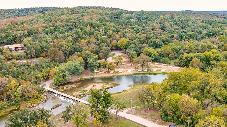 Beautiful South Fork River land with just over 576 feet of river frontage, 16 concrete RV Parking Pads and a bath house. Bath house needs updating. Electric and water hook ups at each RV site, may require updates. Great business opportunity! Call today to schedule your appointment.