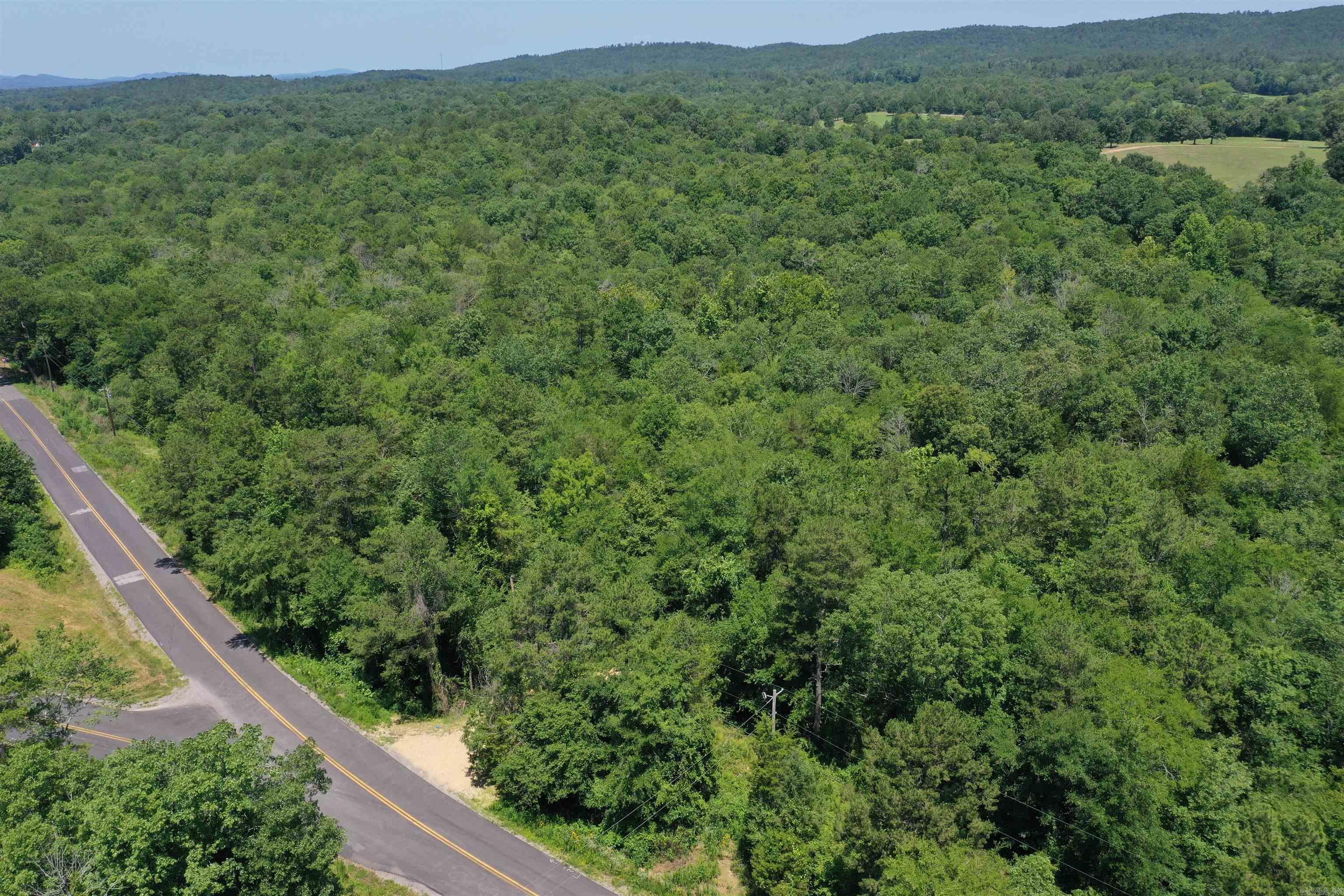 Acreage in Caddo Hills School District! Tract 1 is a 7+/- acre parcel has a new driveway, a seasonal creek, has city water, and is located less than 20 minutes from Glenwood and only 5 minutes to the Caddo River! Agent is related to seller.