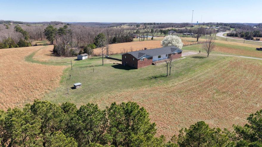 Discover this beautifully renovated 5-bedroom, 4-bathroom brick home on 5 acres in the heart of North Central Arkansas, ideally located between Melbourne and Batesville. Situated on a scenic hilltop, this property offers breathtaking Ozark Mountain views, rural country living, and convenient access to town. This spacious home features 2,161 sq ft on the main level plus a 1,939 sq ft basement, providing ample living space. The main level includes 3 bedrooms, 3 full bathrooms, a large living area, and an open-concept kitchen perfect for entertaining. The partially finished basement adds 2 additional bedrooms, 1 bathroom, and plenty of unfinished space for storage, a workshop, or future expansion. Recent upgrades include a new roof, new HVAC system, and a brand-new back deck—ideal for enjoying the panoramic views and outdoor living. The 5-acre tract offers privacy, room for outdoor activities, and space for gardening, animals, or additional improvements. Additional acreage is available for buyers seeking even more land. This move-in-ready home combines modern updates, acreage, and stunning Ozark scenery for only $349,500.