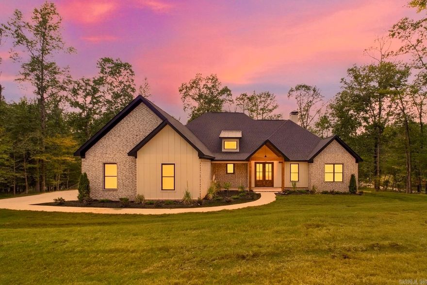 Stunning new construction in gated Big Rock Estates on 1.28 acres! This 4BR/3.5BA home features a cathedral ceiling, abundant natural light, and custom wood details. The open living area with wood-burning fireplace flows into a chef’s kitchen with quartz countertops, spacious island, gas range, and walk-in Butler’s pantry. The primary suite offers a spa-like bath with soaking tub, wraparound shower, double vanities, and oversized closet with laundry access. Upstairs includes a bonus room, bedroom, and full bath, while outside a massive covered porch with wood ceiling detail and fireplace creates the perfect entertaining space. Complete with a 3-car garage and dedicated office. Many upgrades including sprinkler system, foam insulation, and outdoor fireplace with chimney. Bryant Schools!