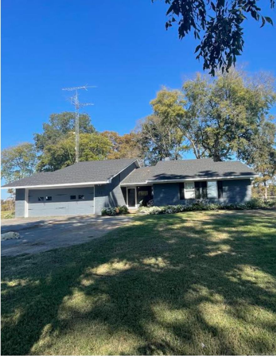 Are you looking for a beautiful lakefront home? This brick home is situated on 150 feet of Lake Chicot frontage.   This recent remodeled 3-bedroom, 2-bath home is nestled on the shores of Lake Chicot, offering the perfect place to call home with beautiful lake views.  Enjoy sun-soaked days on the lake, indulge in water sports, go fishing, or simply unwind on the expansive deck. Private boat dock with concrete boat ramp.  The recently updated kitchen features a large island perfect for cooking or entertaining.  The living room features an open floor plan with fireplace! With its prime location you are sure to call Lake Chicot home! Call the listing office for more information!