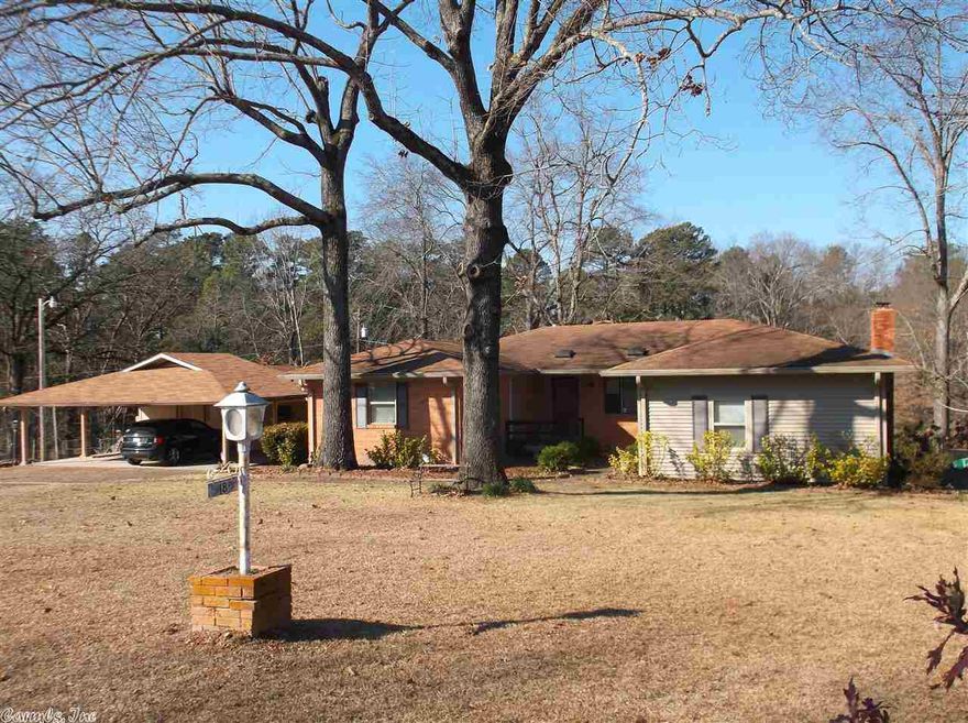 This is a well maintained house with an almost 1 acre double lot. Has a underground tornado shelter & a 20,000 whole house generator in case of power outages. Separate freestanding in-law quarters in back along with a large 3 car carport & storage area. Four person hot tub to convey. This home is priced to sell & won't last long. Sq. Ft. approx. measuring encouraged. See Agent Remarks!