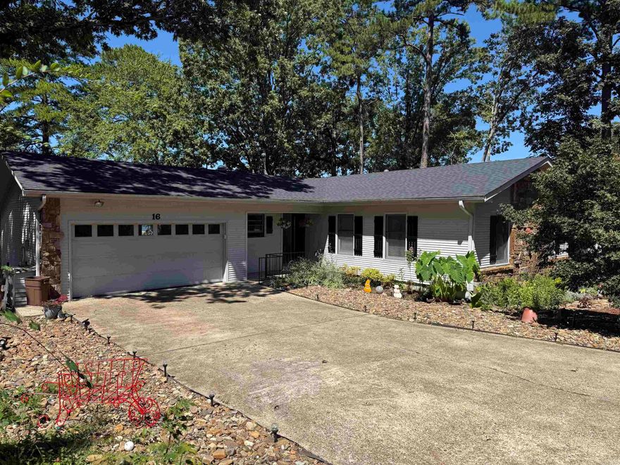 Tucked away in a quiet cut-de-sac, this beautifully updated 3 bedroom, 2 bath home offers stunning views of Lake Desoto and low maintenance living.  Fresh paint and gorgeous new wood flooring throughout.  The updated kitchen features granite countertops, stainless steel appliances, and a copper sink.  Both bathrooms have been refreshed with new tile and granite vanities, and the cozy wood-burning fireplace adds the perfect touch for cooler evenings.  Enjoy lake views year-round from the inviting Arkansas room, or step outside onto the deck that overlooks your private covered boat dock.  The yard is designed for easy upkeep with zero scape mature landscaping, and a sprinkler system.  A fenced 30X10 dog run is perfect for pets and the small workshop in the crawlspace makes for great storage space.    Additional upgrades include a brand new roof (Sept 2025), new water heater (2024) making this home truly move in ready.    This one won't last long-schedule your showing today and experience the beauty of lakefront living in Hot Springs Village.