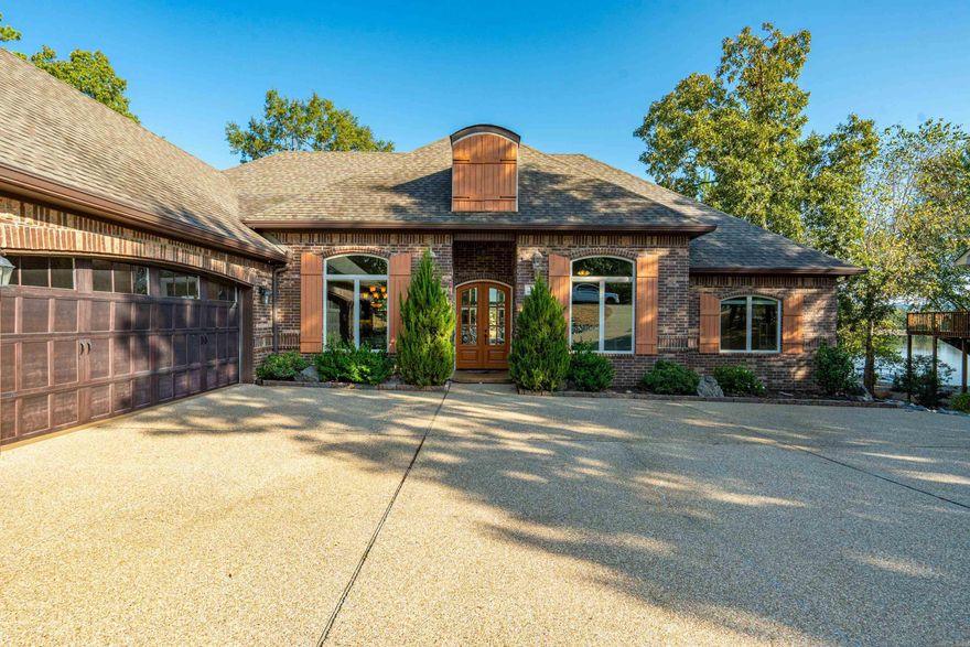 Experience refined lakefront living at 3 Gandia Place in Hot Springs Village, AR—an elegant French Country, all-brick home on Lake Maria, priced at $675,000. This spacious one-level residence offers 2,700 sq. ft. of open-plan design with high volume ceilings, a gas fireplace, and a seamless flow between living, dining, and kitchen featuring granite counters, a large island, double ovens. The split-bedroom layout ensures privacy, with two guest rooms on one wing and a luxurious primary suite on the other, complete with a jetted tub, no-door shower, custom walk-in closet, and direct access to the laundry room. A dedicated office, 2.5 baths, tile, wood, and carpet flooring, and a 3-car garage add to the home's functionality. Outside, enjoy maintenance-free landscaping, beautiful curb appeal, a concrete covered patio, and your own swimming/boat dock for lakeside relaxation. This property blends upscale comfort with thoughtful design—schedule your showing today. Property Disclosure is available for current updates.