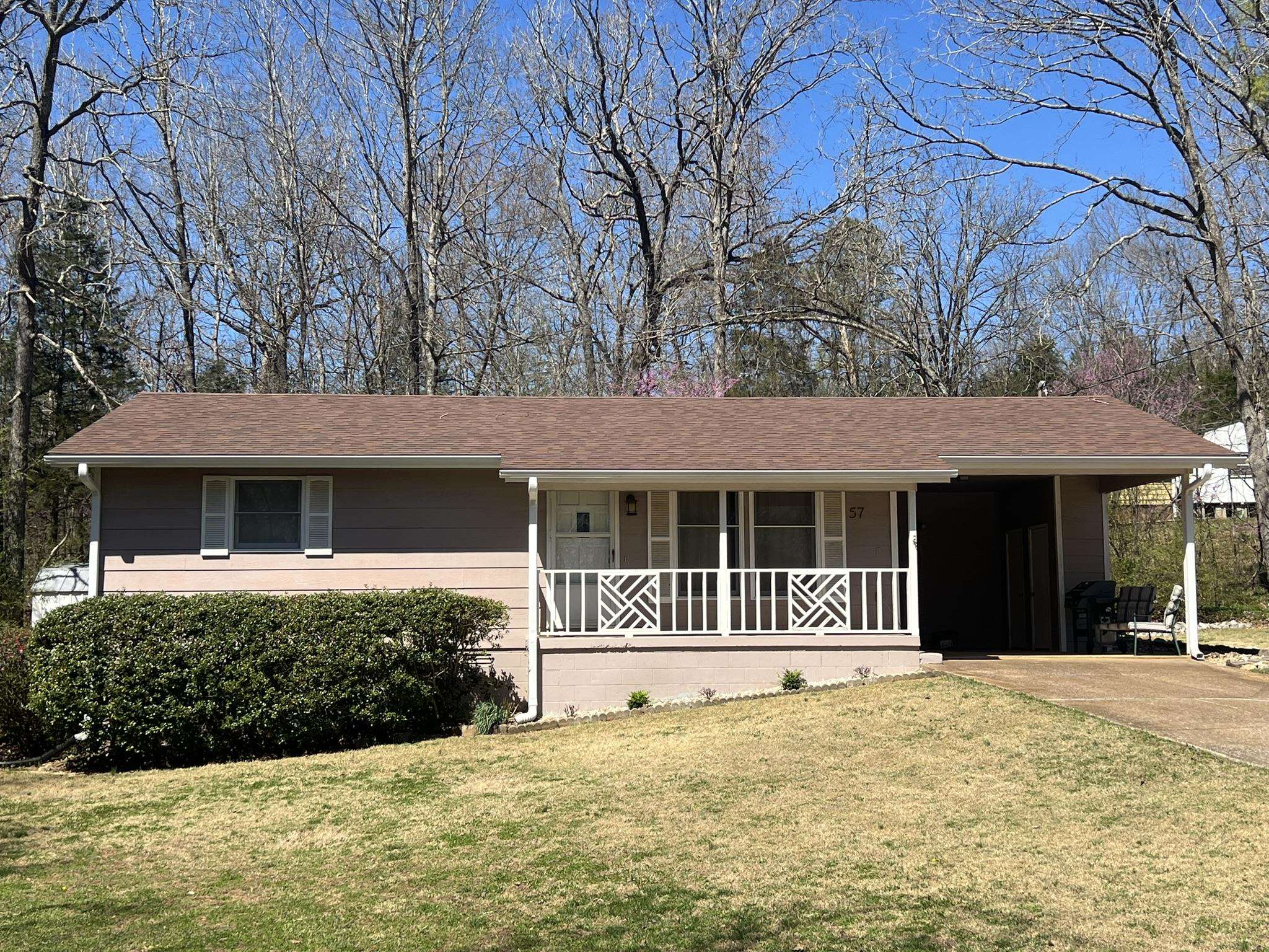 This Charming Country cottage features 2 bedroom 1 bath -with lake view of Lake Thunderbird has been well maintained-and perfect for retiree, a first home or investment...ideal for a vrbo. It's located across from Lake Thunderbird with a really good view of the lake. There is a back deck leading from the dining area, a laundry room & mechanical area. Also, a small garden spot and large detached storage building. It has a new roof and guttering. Priced to sell..quickly.This is a must see.