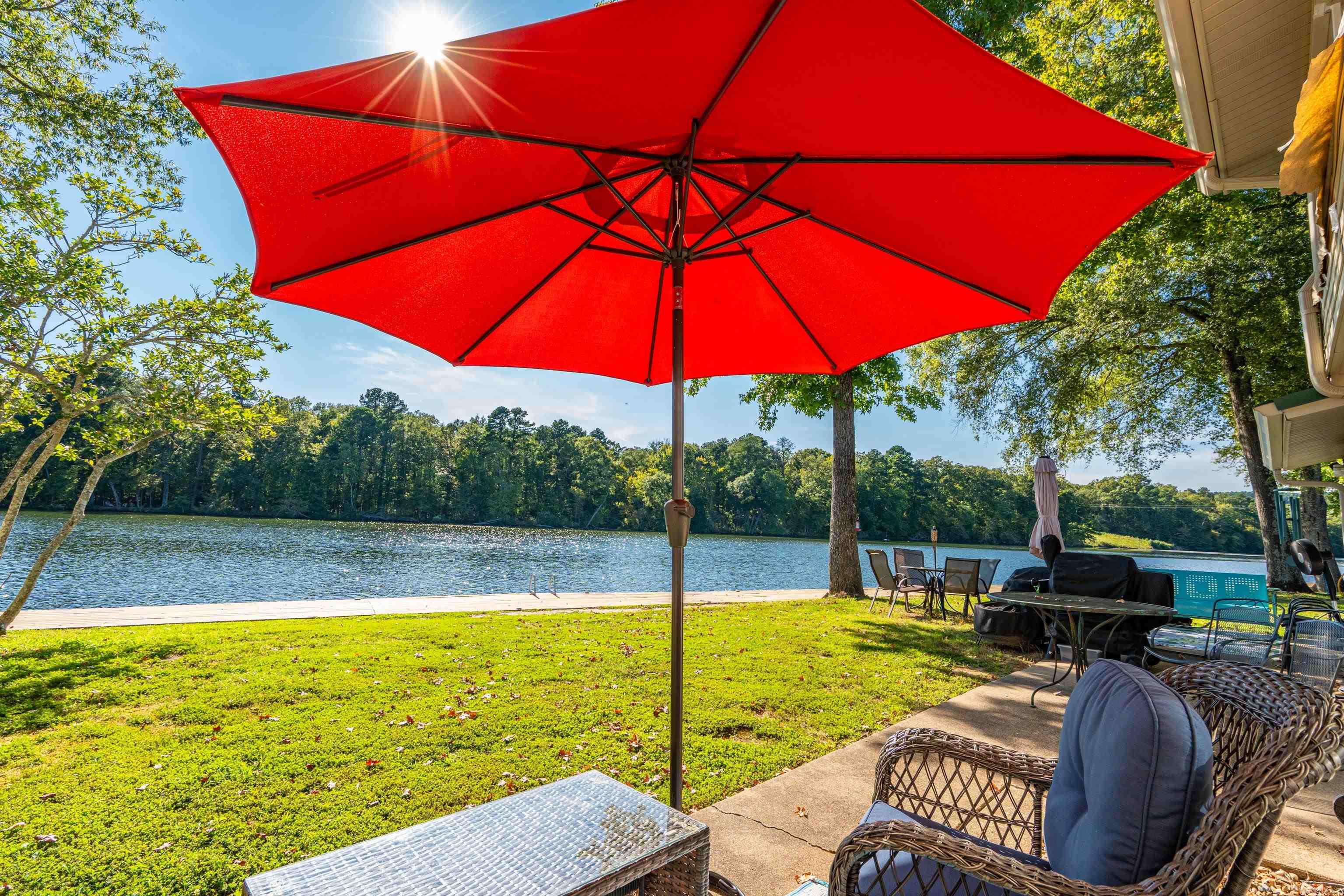 Lakefront Condo Right on the Water for Under $150,000 ā Adorably Decorated with Mid-Century Modern Flair! Experience lakefront living like never before with this charming 1-bedroom, 1-bath condo. Situated just a few steps from the new boardwalk and the sparkling waters of Lake Hamilton, this ground-level unit is the perfect place to relax and enjoy the view. Fully furnished with an adorable, mid-century modern design, this condo is as stylish as it is comfortable. Every corner is thoughtfully decorated to create a cozy and inviting atmosphere, making it an ideal retreat for weekenders or a standout Airbnb rental. Plus, itās not subject to Hot Springs' short-term rental ordinance, so you have the freedom to rent it out when you're not there! With great Wi-Fi, and just minutes from downtown Hot Springs, you'll have easy access to all the city's amenities while enjoying the peaceful, private setting of the well-maintained, gated community. Whether you're seeking a full-time home or a weekend getaway, this condo offers the perfect mix of charm, convenience, and lakefront beauty. This condo is currently an active Short term Rental.