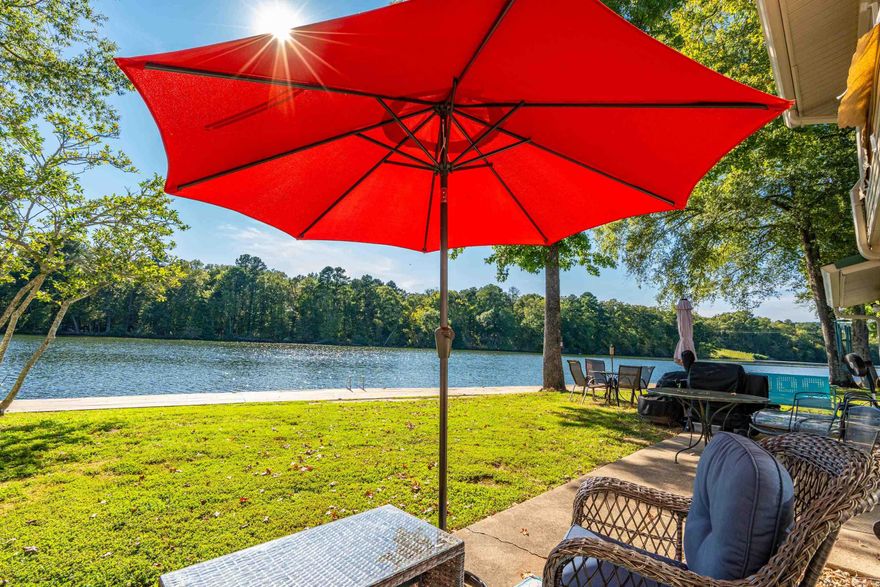 Lakefront Condo Right on the Water for Under $150,000 – Adorably Decorated with Mid-Century Modern Flair!  Experience lakefront living like never before with this charming 1-bedroom, 1-bath condo. Situated just a few steps from the new boardwalk and the sparkling waters of Lake Hamilton, this ground-level unit is the perfect place to relax and enjoy the view.  Fully furnished with an adorable, mid-century modern design, this condo is as stylish as it is comfortable. Every corner is thoughtfully decorated to create a cozy and inviting atmosphere, making it an ideal retreat for weekenders or a standout Airbnb rental. Plus, it’s not subject to Hot Springs' short-term rental ordinance, so you have the freedom to rent it out when you're not there!  With great Wi-Fi, and just minutes from downtown Hot Springs, you'll have easy access to all the city's amenities while enjoying the peaceful, private setting of the well-maintained, gated community. Whether you're seeking a full-time home or a weekend getaway, this condo offers the perfect mix of charm, convenience, and lakefront beauty. This condo is currently an active Short term Rental.