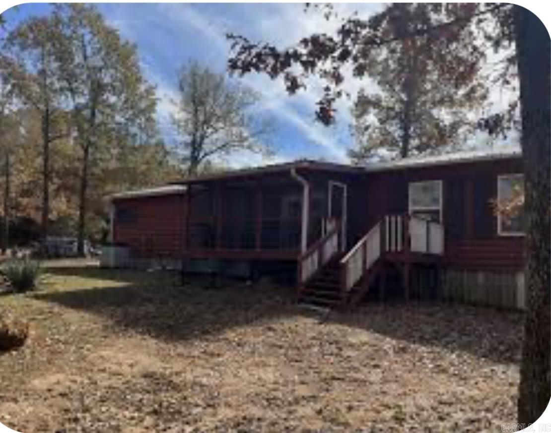 Beautiful log sided home! This is a 1836 square foot, 3 bedroom, 2.5 bathroom, single family home. It has a screened in back porch with 16 foot deck and 50 ft covered porch on front.