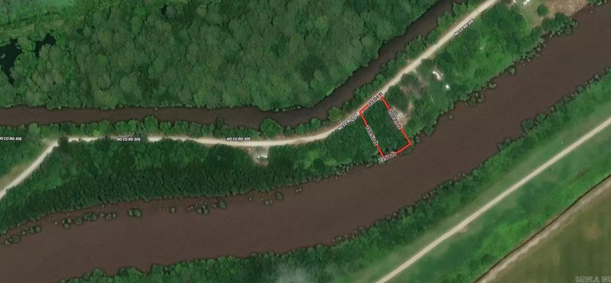 Perfect Little spot for a get a way. Property is waterfront on two sides. Utilities in place. Comes with camper to stay in when visiting and a pontoon boat repurposed as a dock for fishing.