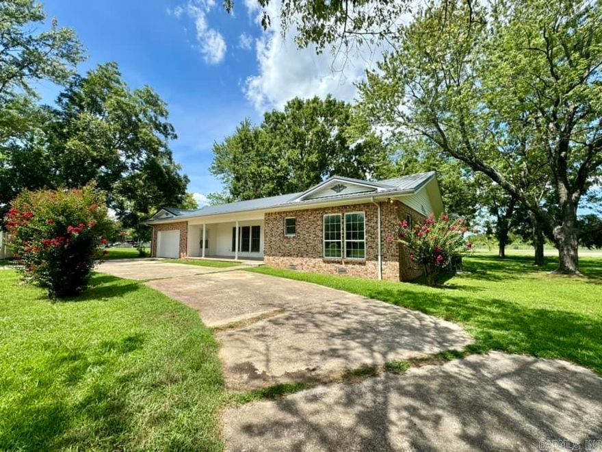 Charming recently updated 3 bedroom-2 bath home that offers a blend of comfort and modern living. This property has had numerous updates including a new metal roof, new CH@A, a spacious new back yard deck and beautiful updated flooring. Doors have been replaced to enhance the aesthetics and functionality of the home. Both bathrooms have been completely remodeled providing a fresh and contemporary feel. A large utility room off the kitchen which is spacious for laundry and storage and can be used as a pantry. The kitchen is workable and spacious. The property features a circle drive making access easy and providing ample parking. The attached one car garage has been updated including a new remote garage door. Outside you will find a storm shelter in the back yard as well as a small storage building. This home is move in ready and offers a beautiful setting for anyoone looking for modern updates and a convenient location.