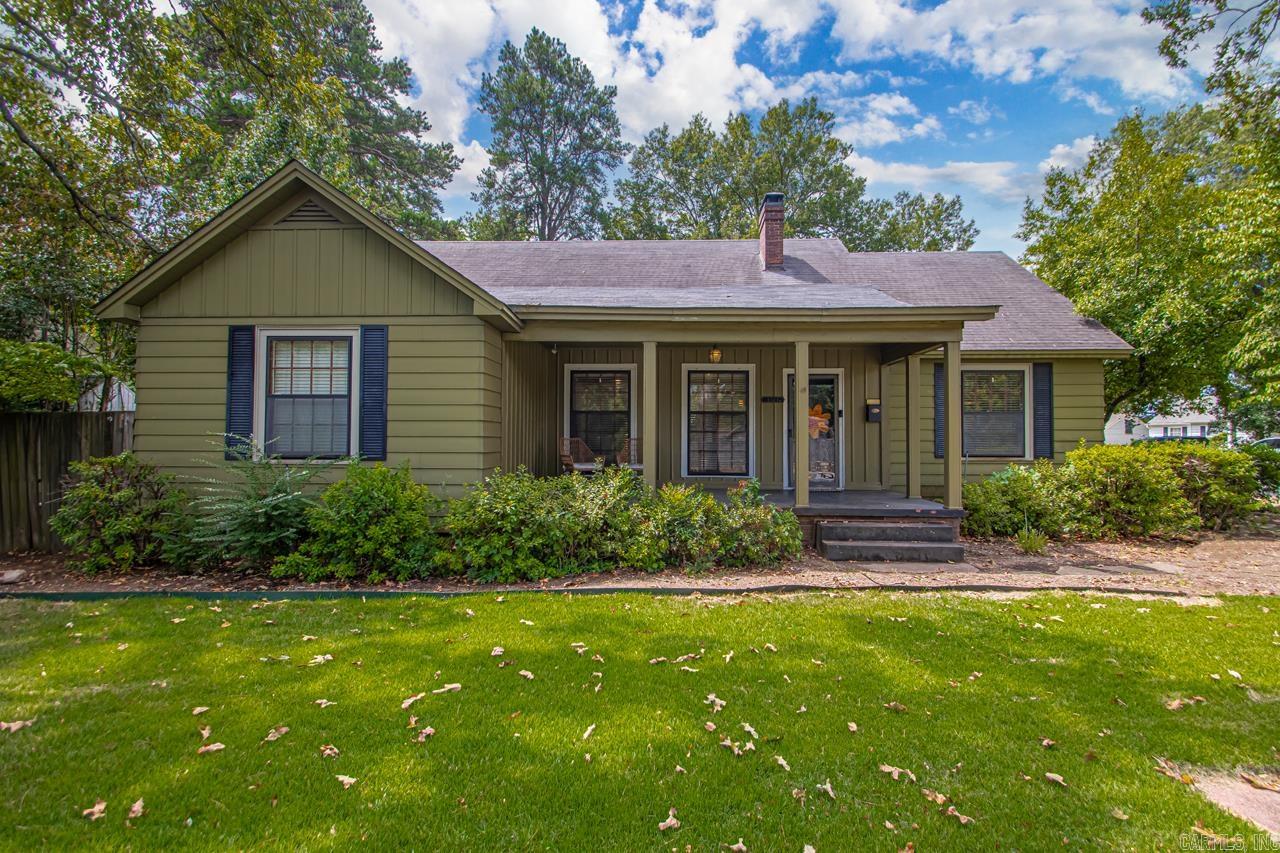 A happy Heights cottage with all of the charm AND all of the upgrades. This wonderful home has ample room for all- two nice sized bedrooms on the main level and then another bedroom and large bonus room upstairs (perfect for additional bedroom or playroom). Two living rooms on main level as well as a sunroom and separate dining room. The outdoor covered patio off the back den offers even more space for entertaining- with a fireplace, TV and room for large table, this space opens to the newly turfed backyard. Easy access to the Heights and Cantrell make this an easy spot, but backing up to the Normandy neighborhood with tons of green space and tree canopy make it truly special. Off street parking, Forest Park school district. Come see!