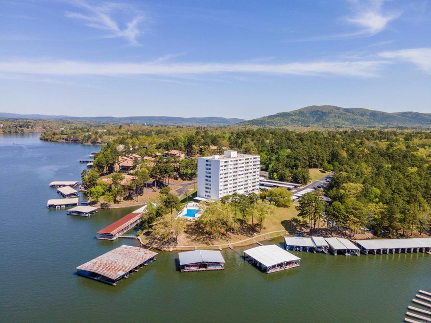 INVESTORS TAKE NOTICE - Beautifully updated, FULLY FURNISHED, move in ready Lake Hamilton 2 bedroom 2 bath condo perfect for short-term vacation rentals or weekend retreat. BOAT SLIP INCLUDED. Relax in this 1,178 sq ft condo including refrigerator, washer and dryer and all furnishings making this property turn-key. Convenient Airport Road location close to everything. Complex features gated entrance, swimming pool, tennis courts, covered patio area, exercise/fitness room, pool table, tennis court, outdoor grills, manager's office, family room & so much more. Includes 1 covered parking space.