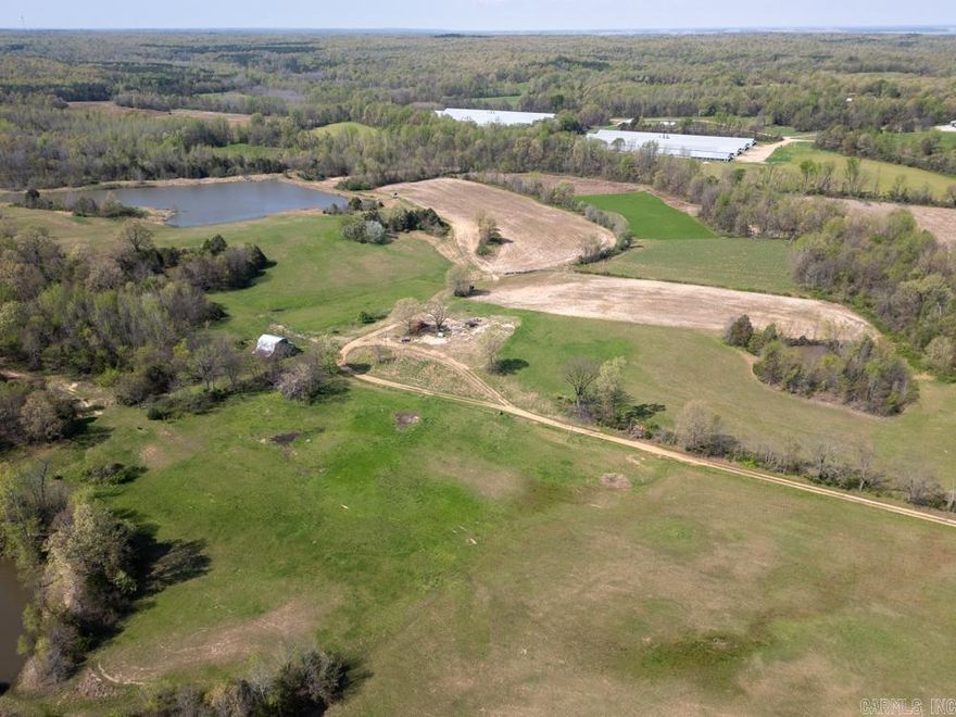 This one-of-a-kind property has been meticulously maintained and managed under a Don Higgins Management Plan, with every acre thoughtfully designed to enhance habitat, attract wildlife, and offer exceptional outdoor experiences year-round. The land features a diverse and strategic mix of habitat types, including 12 +/- acres planted in soybeans, 8 +/- acres in lush clover, and 17 +/- acres of switchgrass bedding areas—all providing high-quality food and cover for trophy whitetails and wild turkeys. There's even a designated 20 +/- acre sanctuary that is completely hands-off, keeping the pressure low, bucks comfortable, and optimizing hunter success. Two premium Redneck blinds are already in place, just climb in and hunt. It is loaded with wildlife and has been consistently producing mature whitetails and springtime gobblers.  A live creek dissects the heart of the property providing year-round water, seamless access to and from stands, and acting as a wildlife highway funneling the deer through food and bedding. A stunning 4.5 +/- acre stocked lake provides fantastic fishing and would also be a great backdrop to a cabin or home from one of the many build sites on the farm.