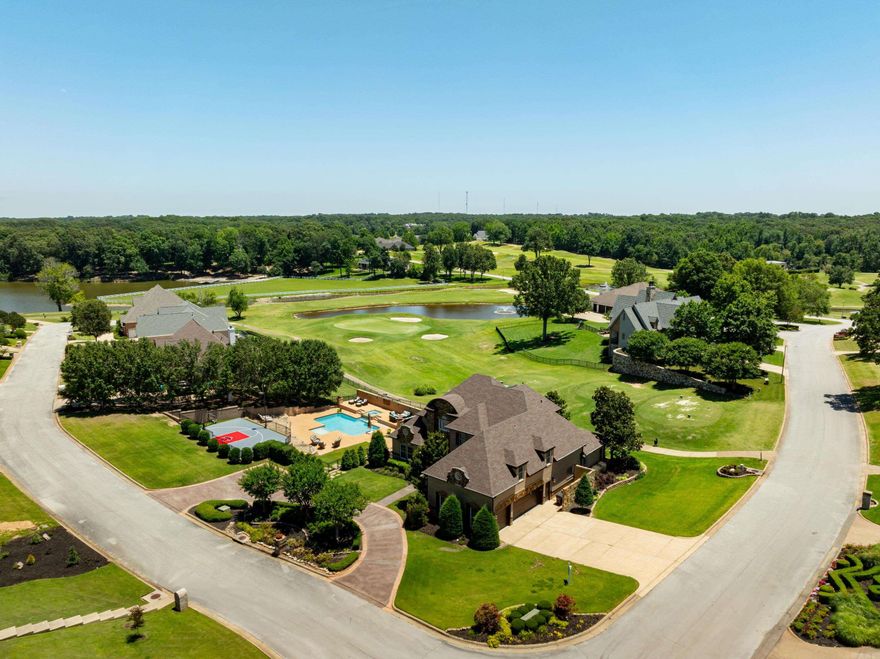 RidgePointe luxury on the 7th hole! Custom, move-in-ready estate on a corner lot with ~7,990+/- sq ft under roof, 5BR/5.5BA, and 3-car garage. Resort amenities: private pool & hot tub, sport court, two theater rooms, chef’s kitchen (island, gas cooktop + grill, double ovens, stainless + Miele coffee), sunroom with golf views, indoor/outdoor kitchen & bar, and three laundry areas. Main-level luxury primary suite + guest suite. Upstairs: 3BR/2BA + 2nd laundry; Basement: theaters, game room, lounge/sunroom, kitchenette, full bath, 3rd laundry, roll-up to outdoor living. HOA ~ $1,950/yr with golf, tennis, dining, events. Pre-paid Pope Lawn Care through 4/2026. Vacant & ready now. Agent-owned.