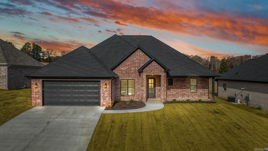 Sleek, stylish, and Efficient—this gorgeous all-brick, one-level new construction home blends modern design with everyday functionality. Featuring 3 bedrooms, 2.5 baths, and a dedicated office space just off the foyer, this home was built for both comfort and versatility. Step into the open-concept layout where the kitchen stuns with quartz countertops, a large island, soft-close custom cabinetry, gas stove, and a walk-in pantry. The spacious laundry room is oversized for convenience and storage, while additional closets throughout the home keep life organized. Each bedroom is generously sized with large walk-in closets, including a Jack-and-Jill setup. The primary suite is a true retreat—highlighted by a bathroom with high-end finishes and a closet larger than most bedrooms. Other features include fiber internet, natural gas, a tankless water heater, and clean, contemporary finishes throughout. Priced to move and ready for its first homeowners—this is modern living made easy.