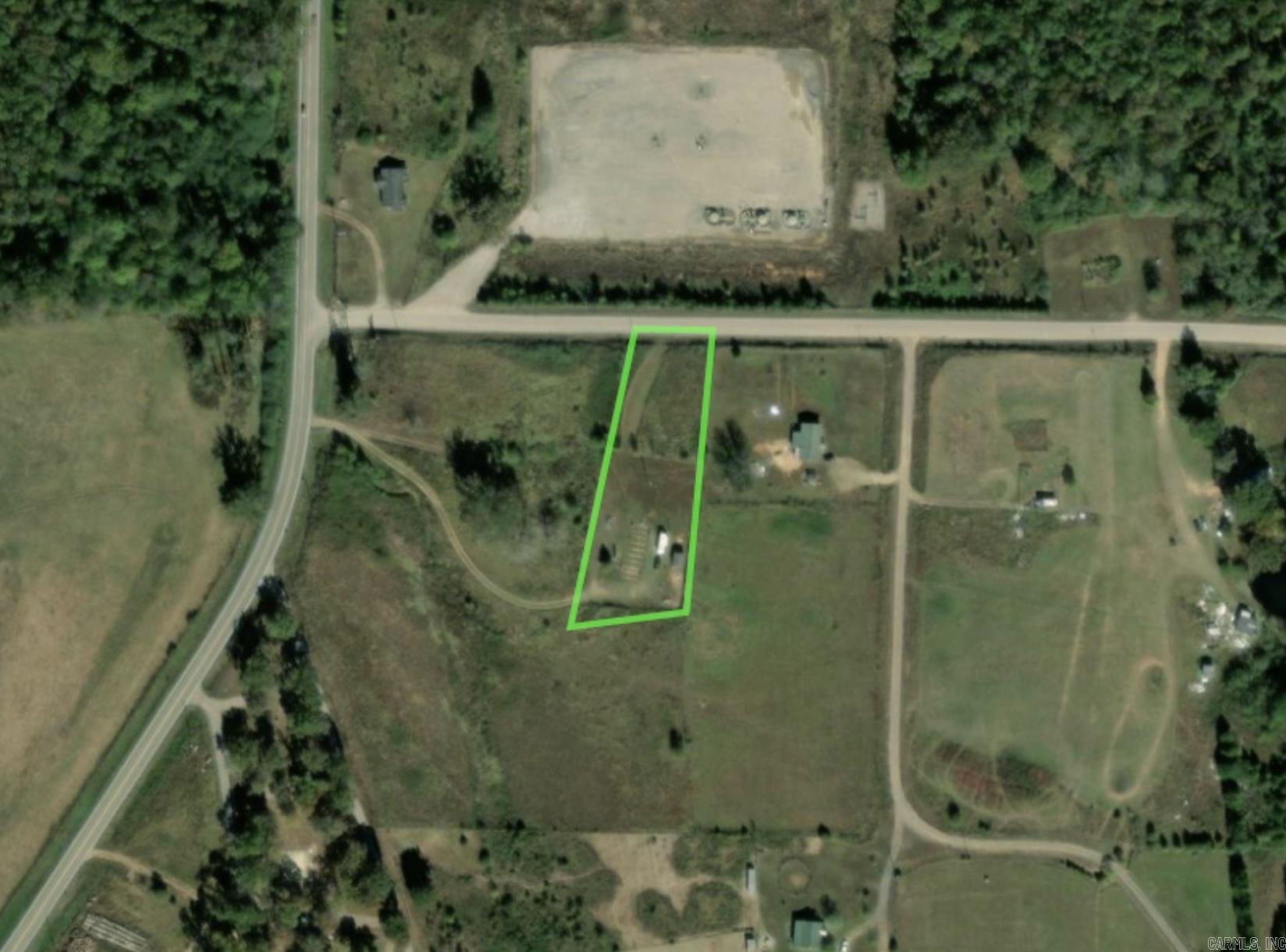 Property is fenced and totally cleared with a 12x28 tiny house/shop and a storage building.  Property also has a concrete footing for a 28x60 mobile home pad.  Property has electric and septic tank. No annual tax information available on county data website.