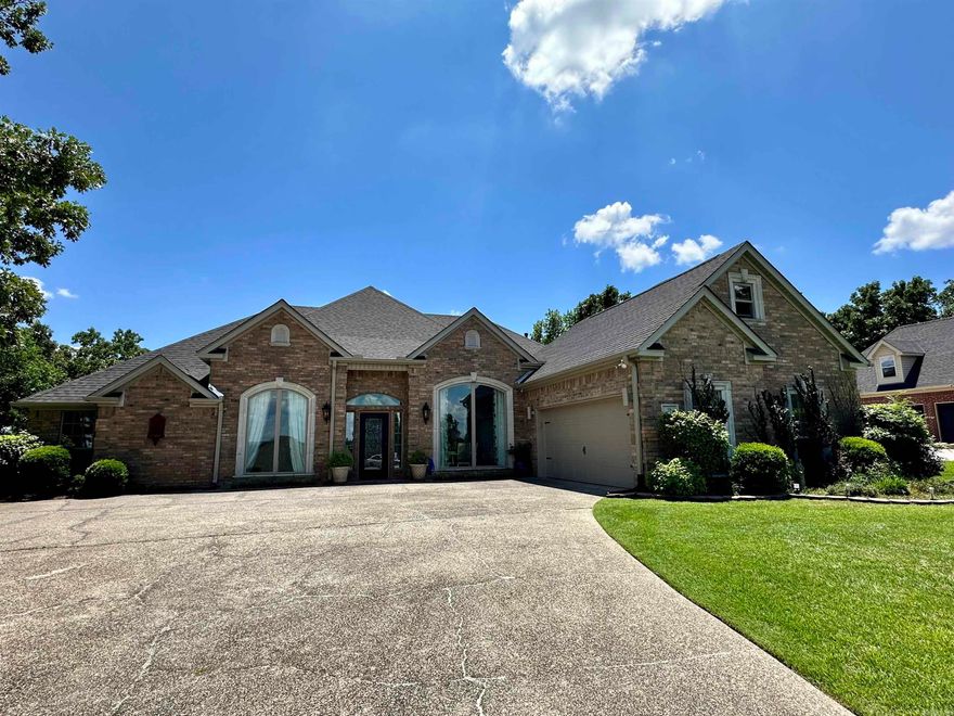 Embrace the comfort of this beautiful gated Stonegate Subdivision home. This home has been completely updated to include:  engineered wood flooring, light fixtures throughout, granite countertops in kitchen and downstairs bathrooms, sinks, toilets, roof, gutters, garage door and 2 new HVAC units.  Open concept kitchen overlooking the living room and breakfast nook.  Large living room with a wall of windows overlooking Mt Riante with views of Lake Hamilton from the front.  Elegant formal dining room and media room or office space.  In-law quarters or detached office space off back deck. Tons of storage. The large back deck extends almost entire width of home.  Additional lot included outside of gated backyard to east of fence to build the perfect outdoor oasis.  Stonegate Subdivision offers a private boat launch and storage, pool, clubhouse and tennis courts.