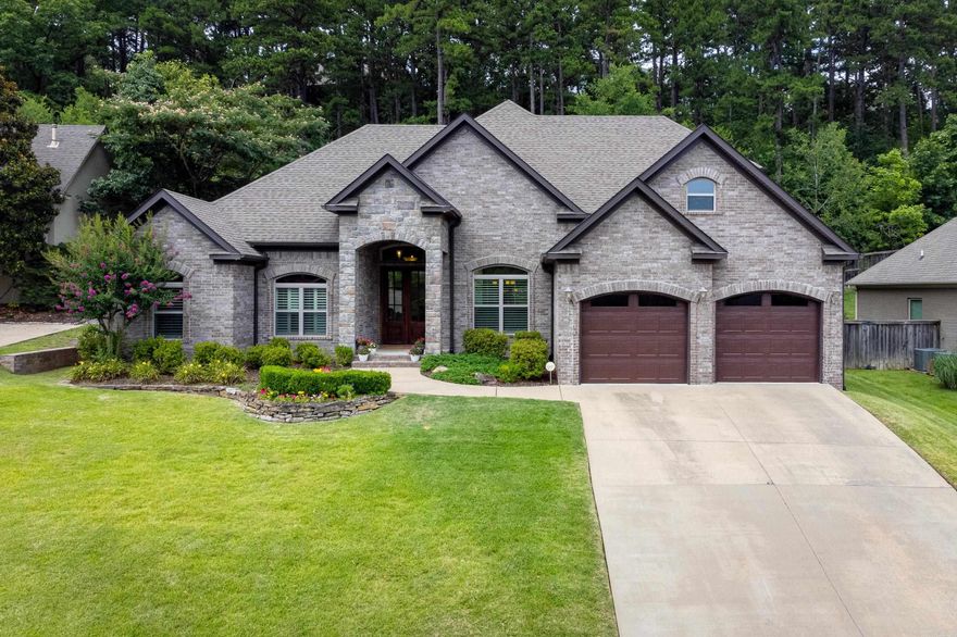 Immaculate home on gorgeous lot with plenty of privacy. Elevated finishes and attention to detail throughout including stunning door casings, chair rails and tray ceilings. Floor plan is perfect for entertaining and family living. Inviting foyer, large open living area with fireplace, and separate office with coffered ceiling. Lovely kitchen with stainless appliances. Private primary suite with spa-like bath and fabulous closet. Great layout with an additional en suite bedroom downstairs. Upstairs has two bedrooms plus fantastic bonus room. Oversized closets throughout. This home has soaring ceilings and abundant natural light. Back yard features a covered patio and fire pit. Two car garage and wonderful landscaping. Walkable to playground and pool. Super special home in Woodland’s Edge. Turn-key!