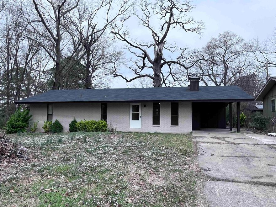 Inviting home with bricked fireplace, newly painted kitchen cabinets and living room AND new carpet! Lots of natural light from oversized windows and a large sliding glass back door. Partially fenced backyard with patio and concrete sidewalk that leads to the front of the house. This house is ready to be your home today!